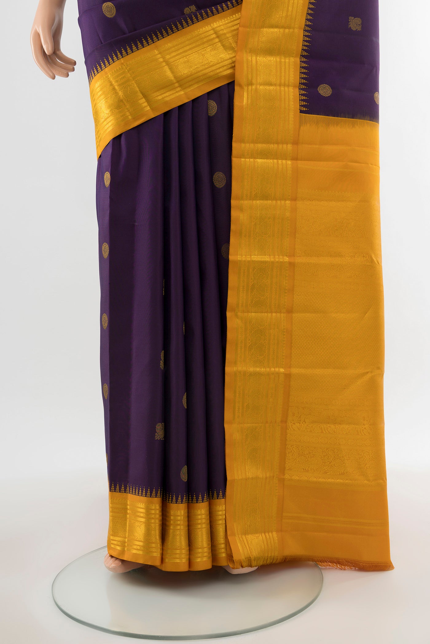 Pleats and pallu of Pure Silk Pure Zari Violet Kanchipuram Saree with Zari Butta on the body and Silk Border. 