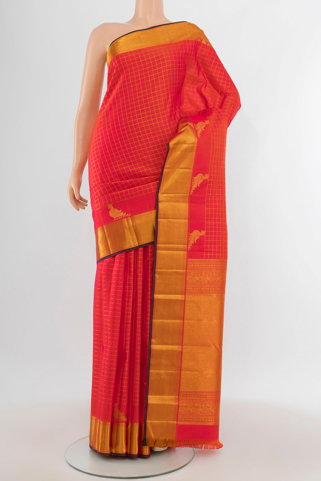 Brick Orange Dual Tone Kanchipuram Silk Saree with Checked design on the body and Zari Border.  displayed on a mannequin