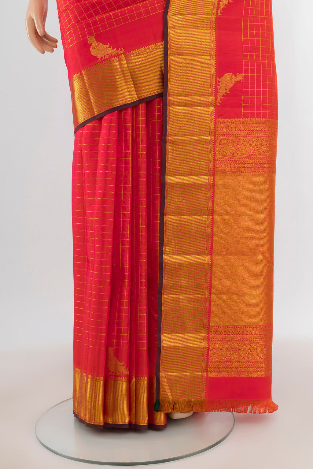 Pleats and pallu of Brick Orange Dual Tone Kanchipuram Silk Saree with Checked design on the body and Zari Border. 