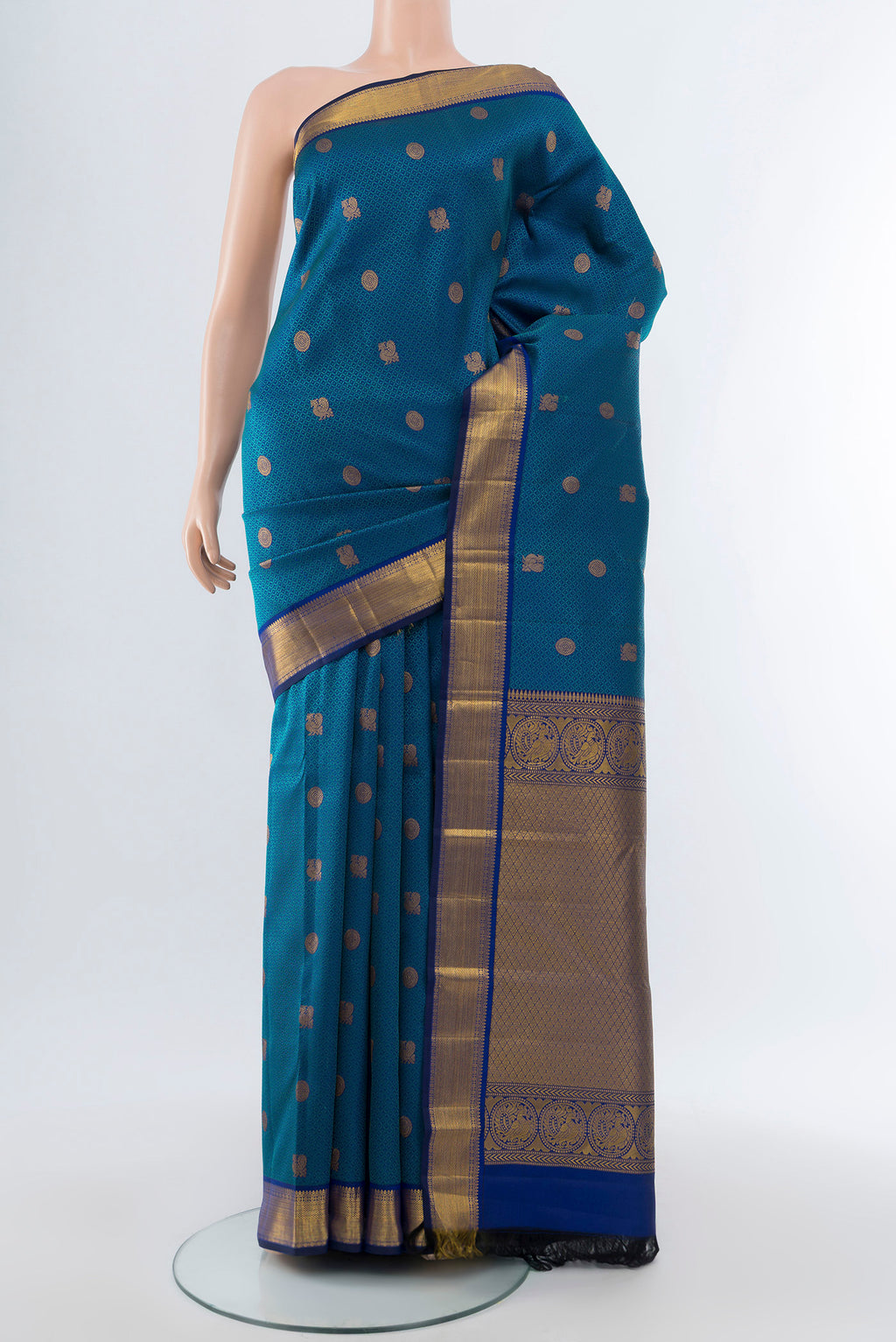 Pure Silk Pure Zari Dark Blue Kanchipuram Saree with Zari Butta on the body and Silk Border.  displayed on a mannequin
