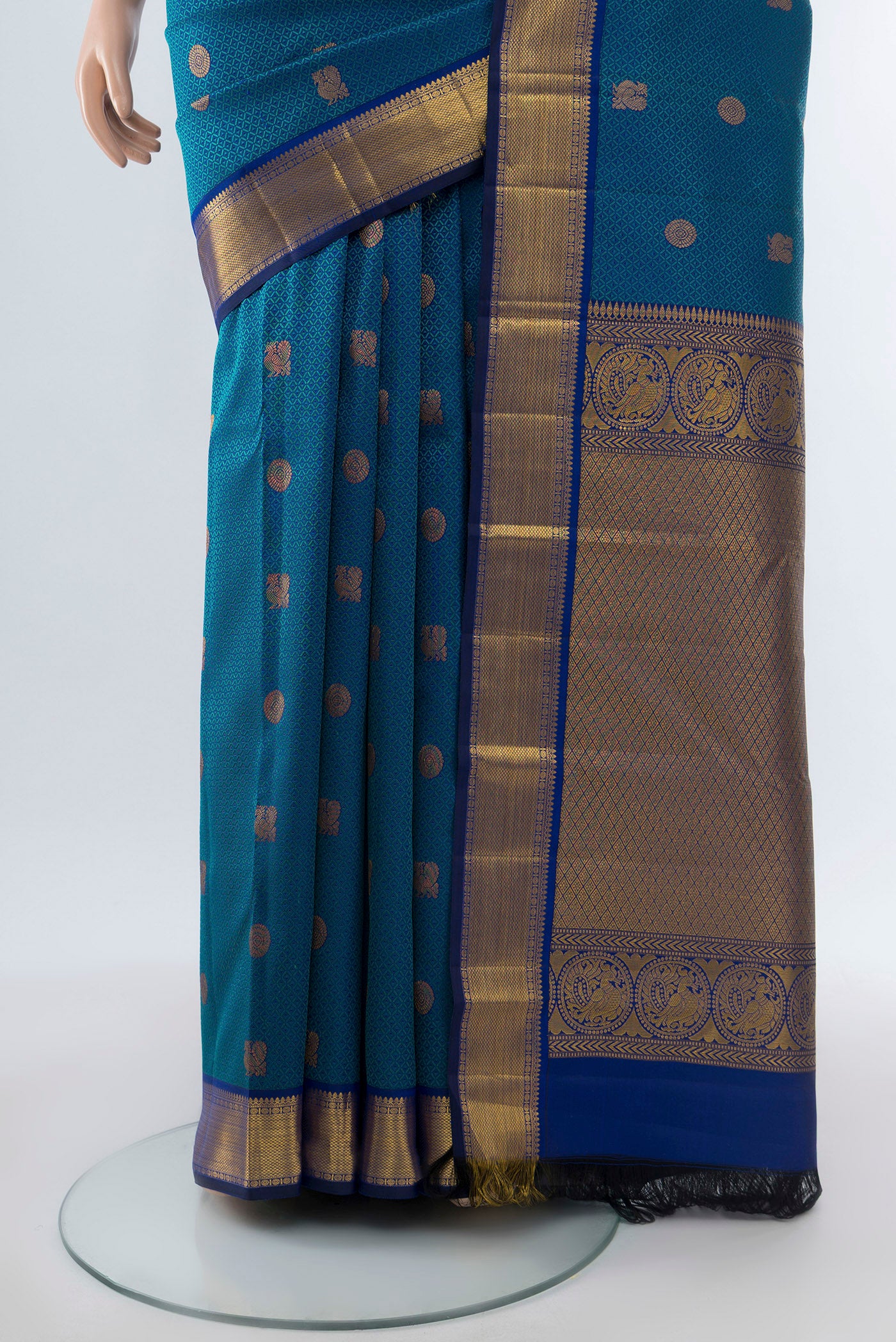 Pleats and pallu of Pure Silk Pure Zari Dark Blue Kanchipuram Saree with Zari Butta on the body and Silk Border. 