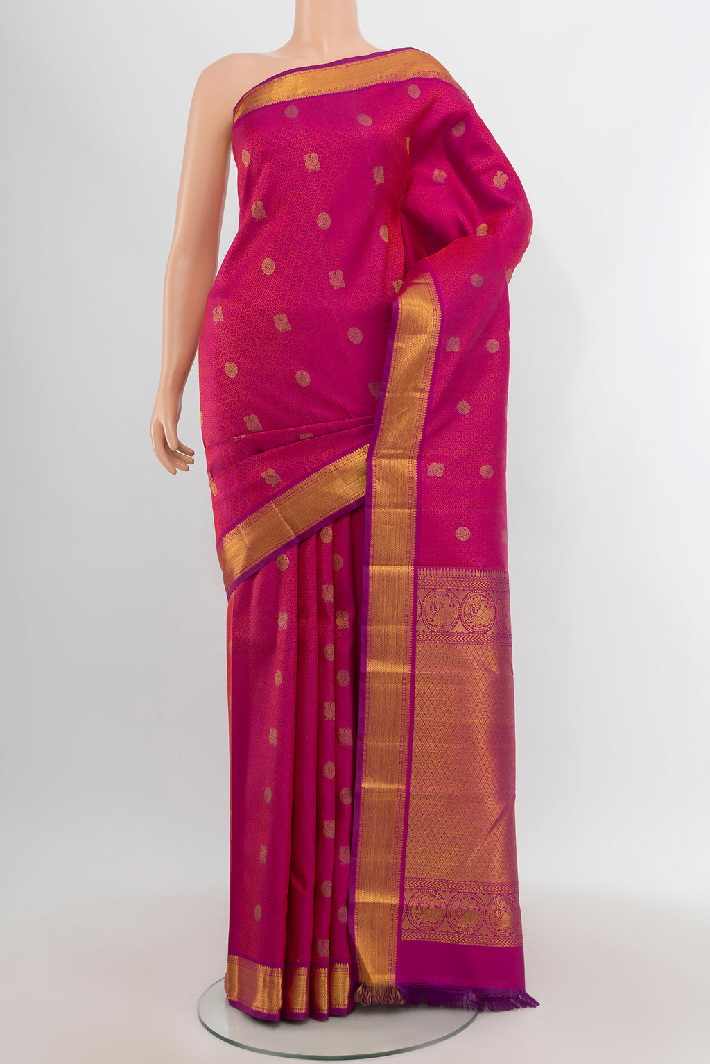 Pure Silk Pure Zari Magenta Kanchipuram Saree with Zari Butta on the body and Zari Border.  displayed on a mannequin
