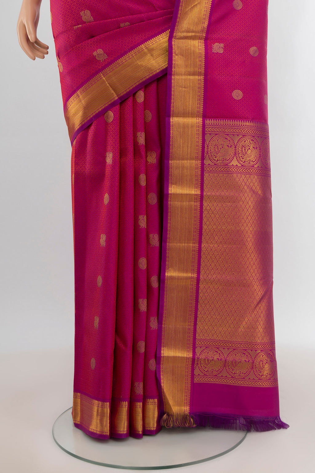 Pleats and pallu of Pure Silk Pure Zari Magenta Kanchipuram Saree with Zari Butta on the body and Zari Border. 
