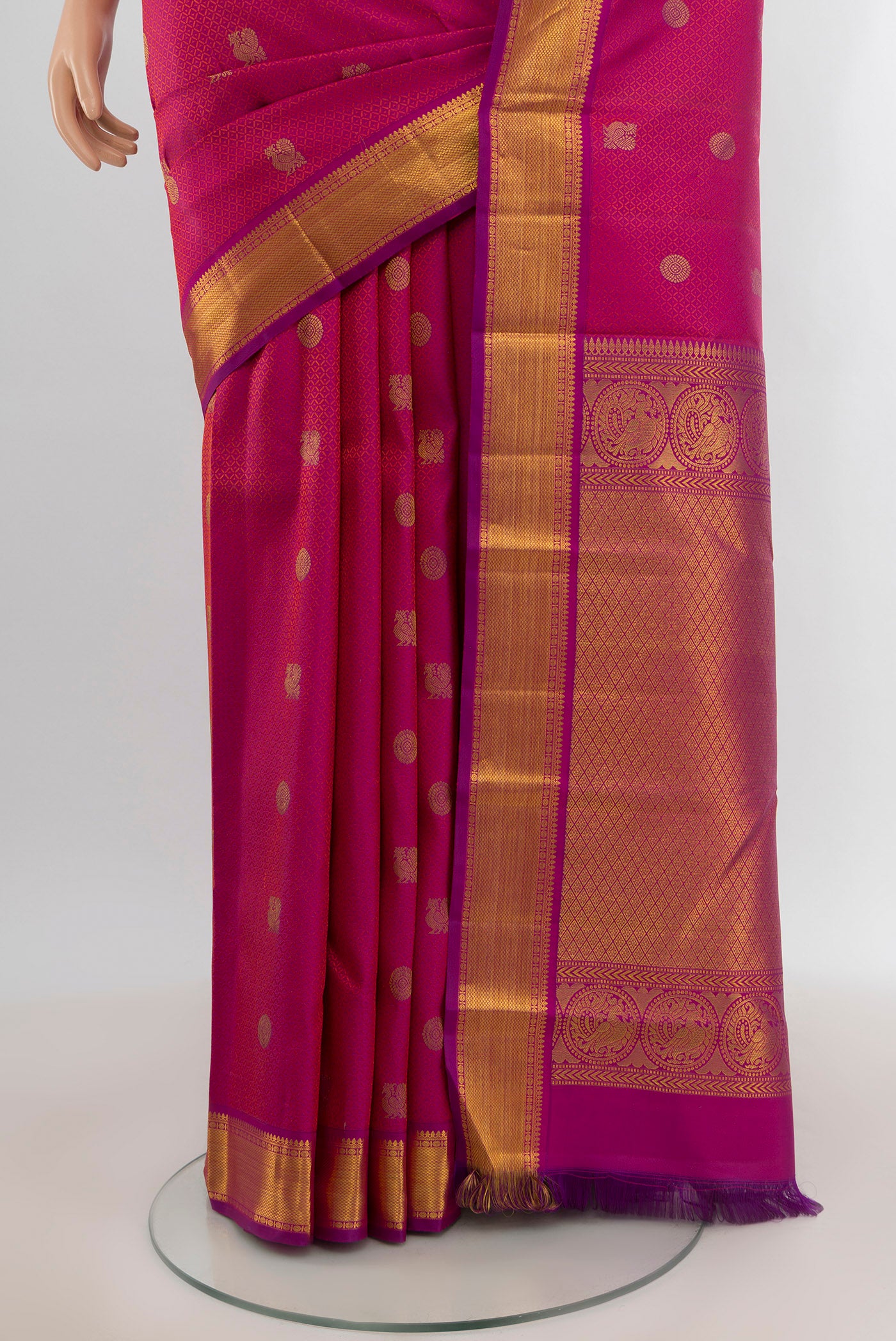 Pleats and pallu of Pure Silk Pure Zari Magenta Kanchipuram Saree with Zari Butta on the body and Zari Border. 