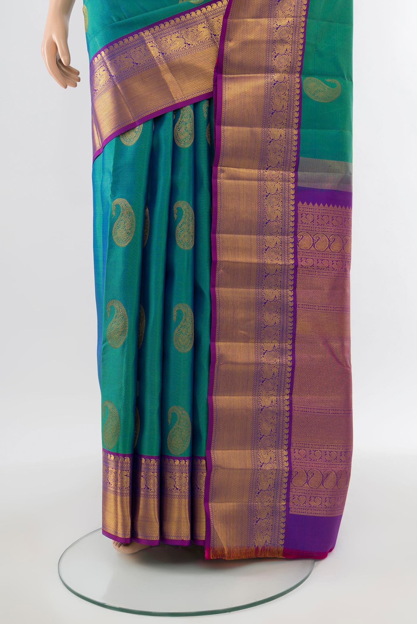 Pleats and pallu of Pure Silk Pure Zari Peacock Blue Kanchipuram Saree with Zari Butta on the body and Silk Border. 