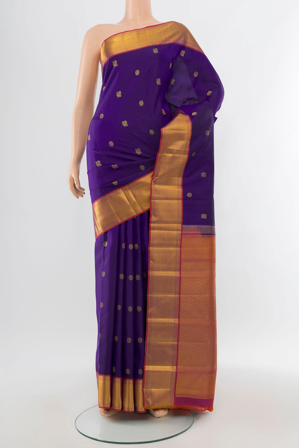 Pure Silk Pure Zari Dark Blue Kanchipuram Saree with Zari Butta on the body and Silk Border.  displayed on a mannequin