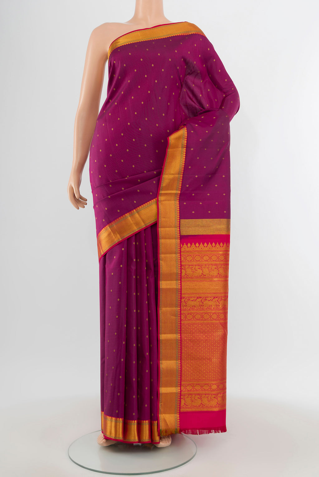 Purple Kanchipuram Silk Saree with Zari Butta on the body and Zari Border.  displayed on a mannequin