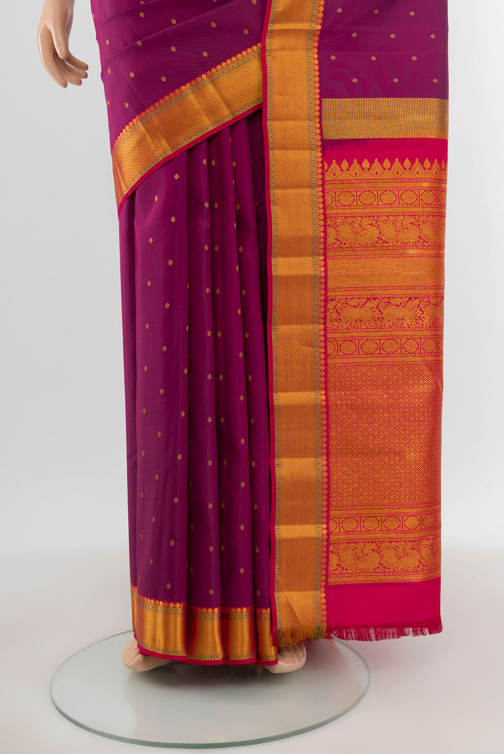 Pleats and pallu of Purple Kanchipuram Silk Saree with Zari Butta on the body and Zari Border. 