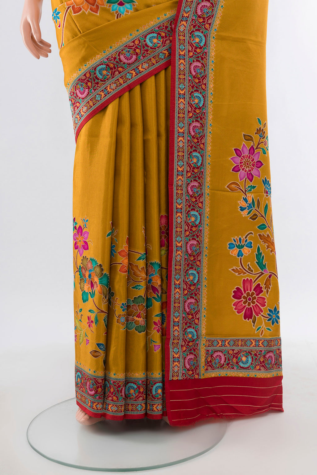 Pleats and pallu of Mustard Art Silk Saree with Zari Butta on the body and Silk Border. 