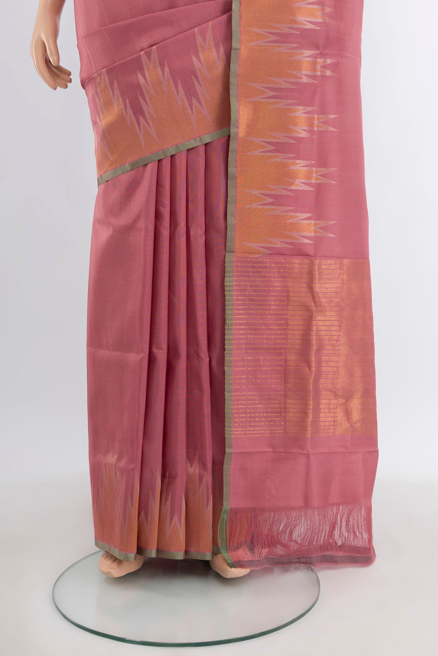 Pleats and pallu of Rose Gold Uppada Silk Saree with Plain Body and Temple Border. 