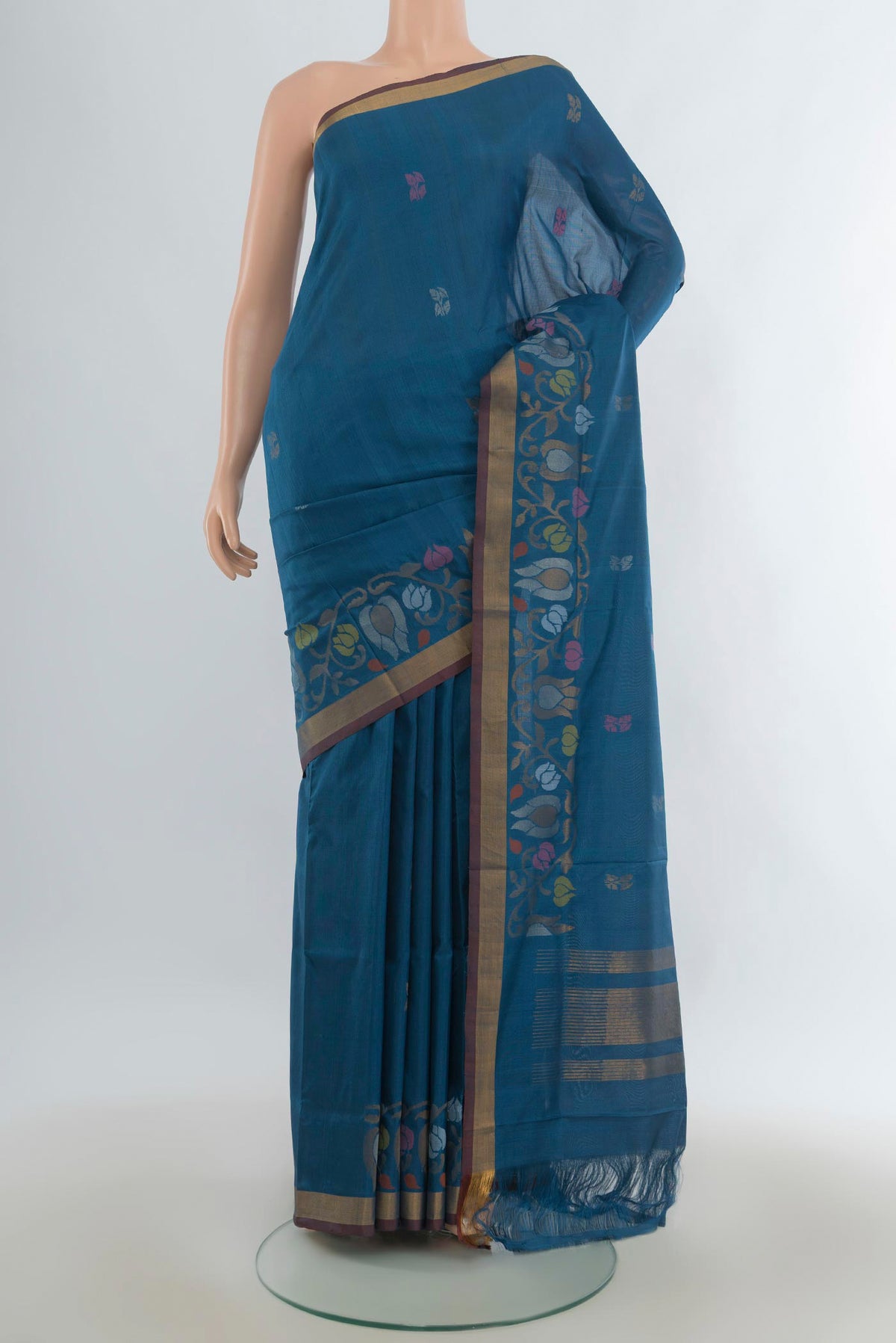 Pure Silk Peacock Blue Uppada Saree with Zari Butta on the body and Zari Border.  displayed on a mannequin