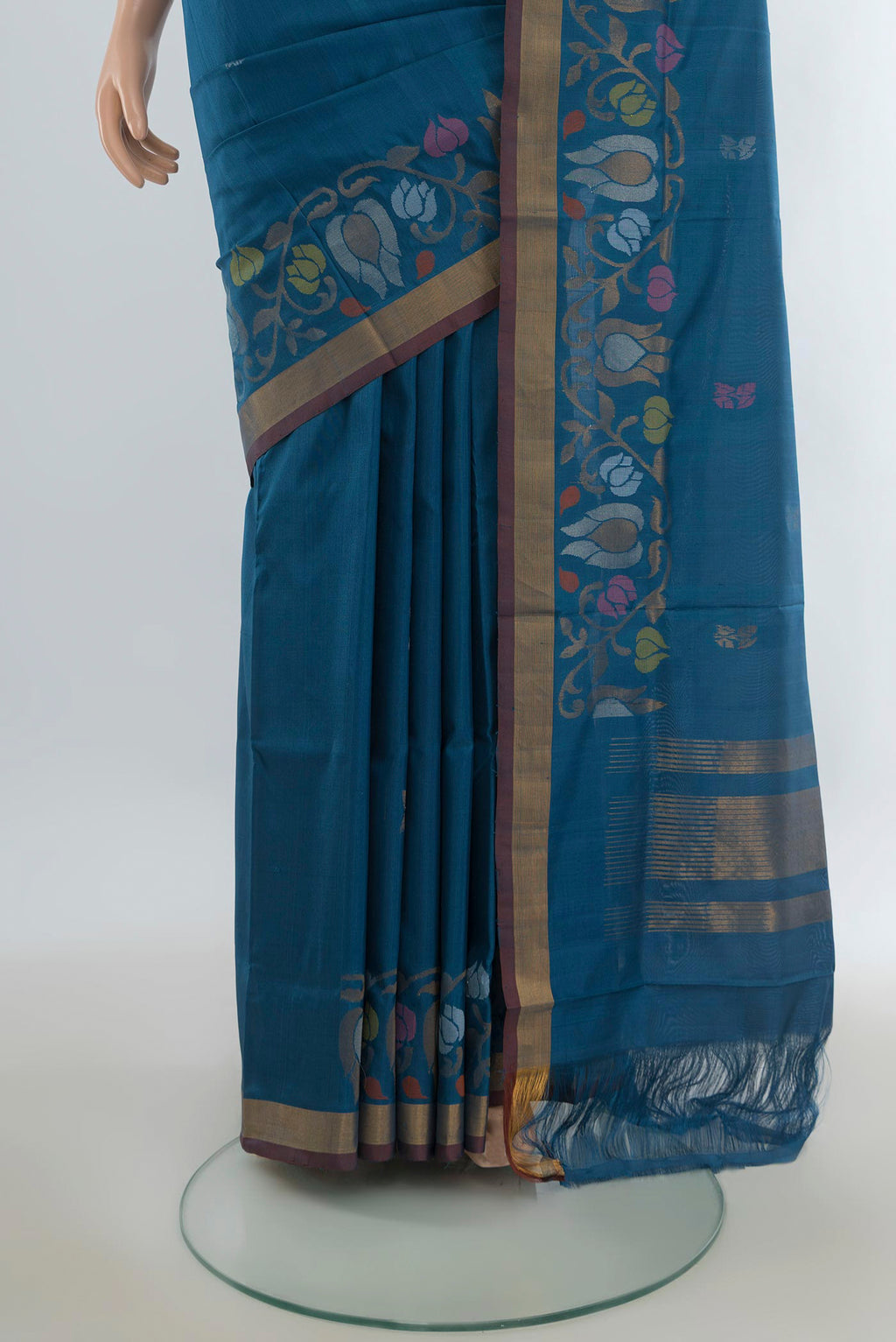 Pleats and pallu of Pure Silk Peacock Blue Uppada Saree with Zari Butta on the body and Zari Border. 