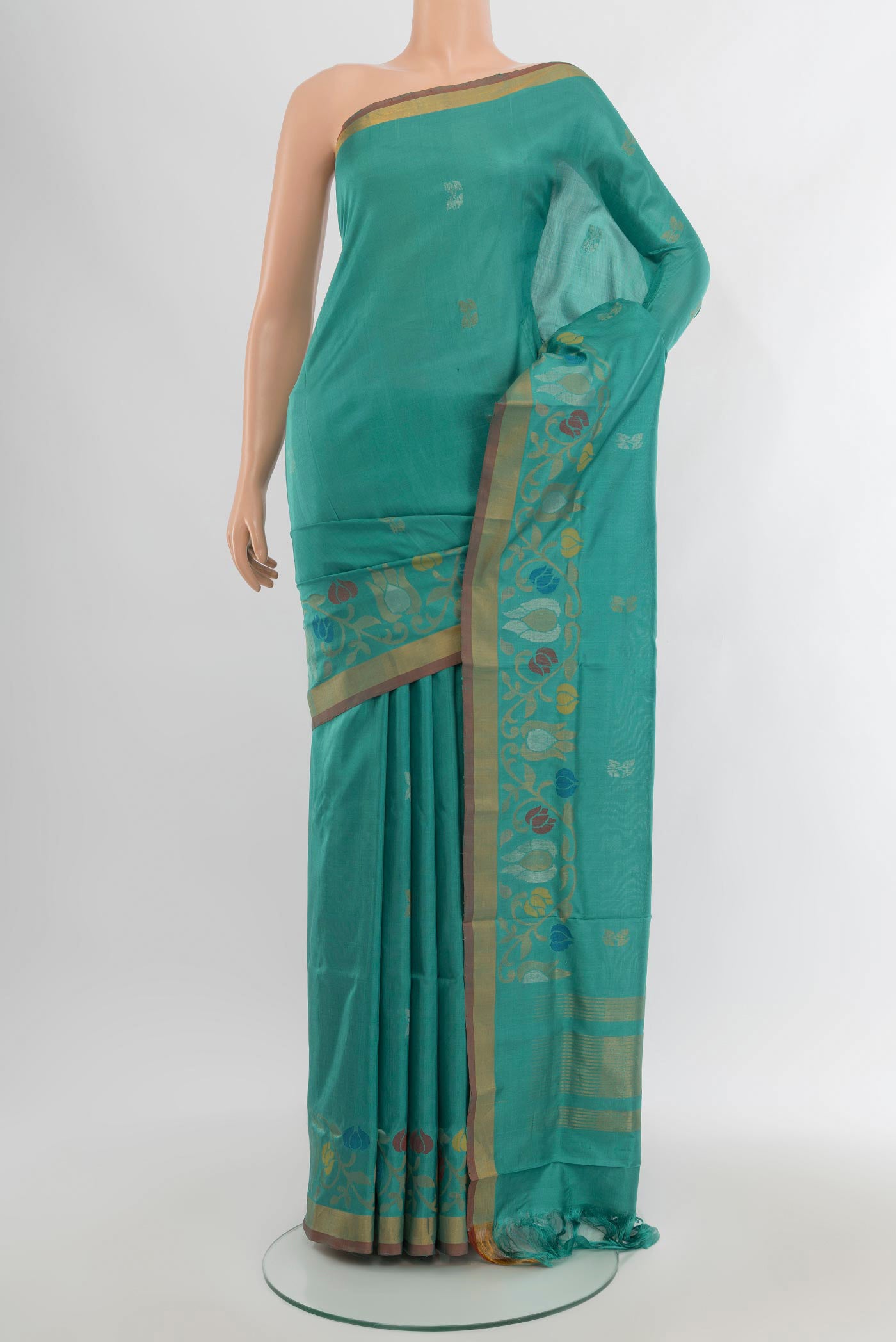 Light Blue Uppada Silk Saree with Zari Butta on the body and Zari Border.  displayed on a mannequin