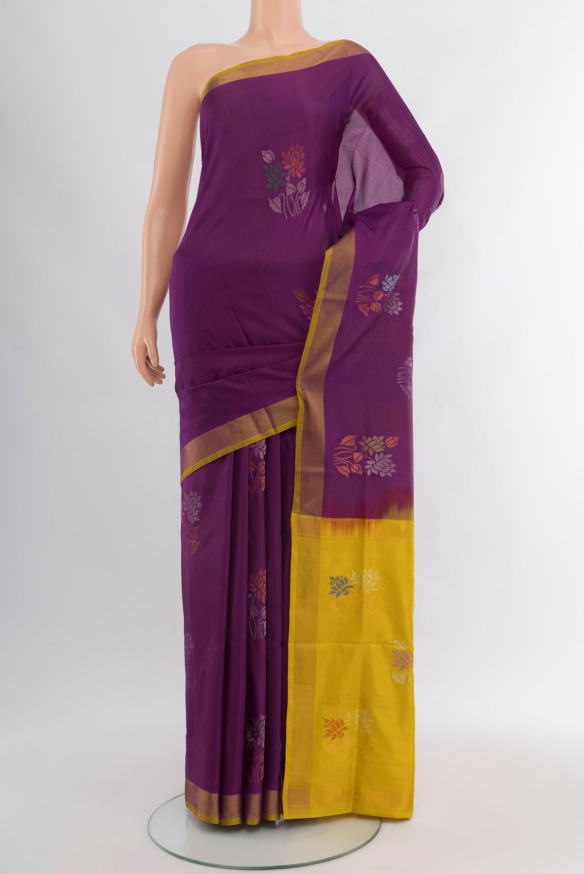 Purple Uppada Silk Saree with Zari Butta on the body and Zari Border.  displayed on a mannequin