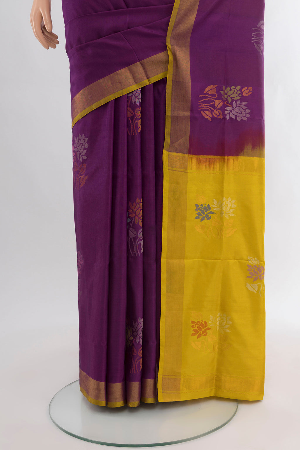 Pleats and pallu of Purple Uppada Silk Saree with Zari Butta on the body and Zari Border. 