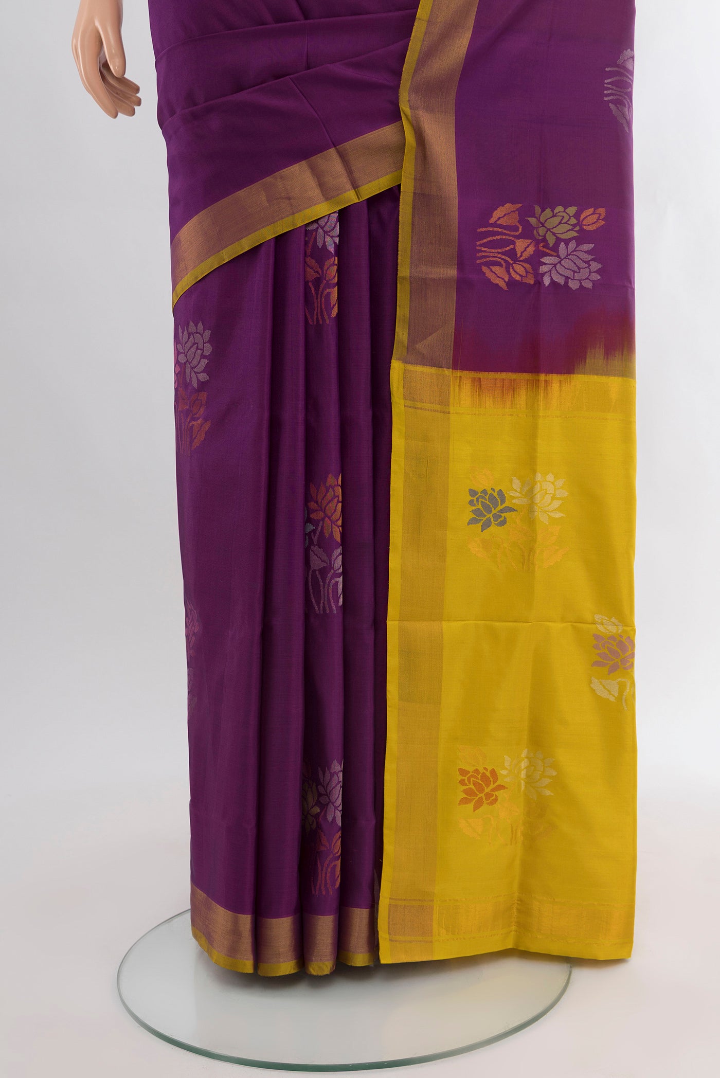 Pleats and pallu of Purple Uppada Silk Saree with Zari Butta on the body and Zari Border. 