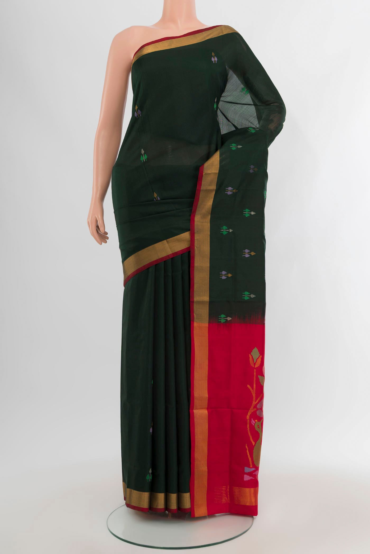 Bottle Green Uppada Silk Saree with Zari Butta on the body and Zari Border.  displayed on a mannequin