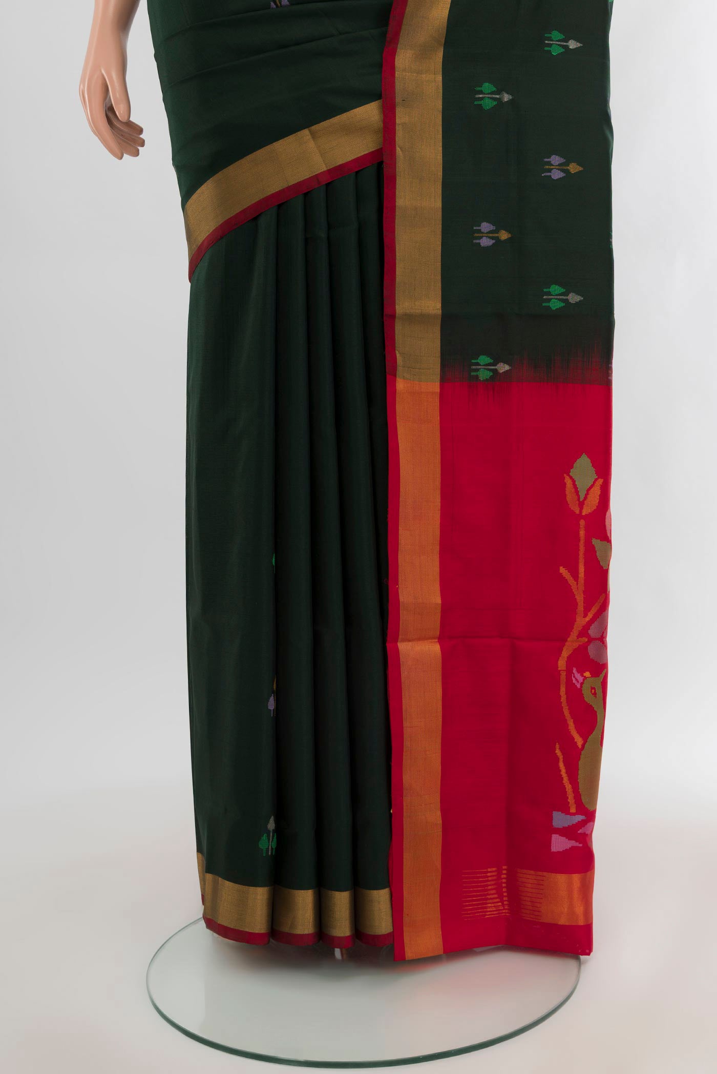 Pleats and pallu of Bottle Green Uppada Silk Saree with Zari Butta on the body and Zari Border. 