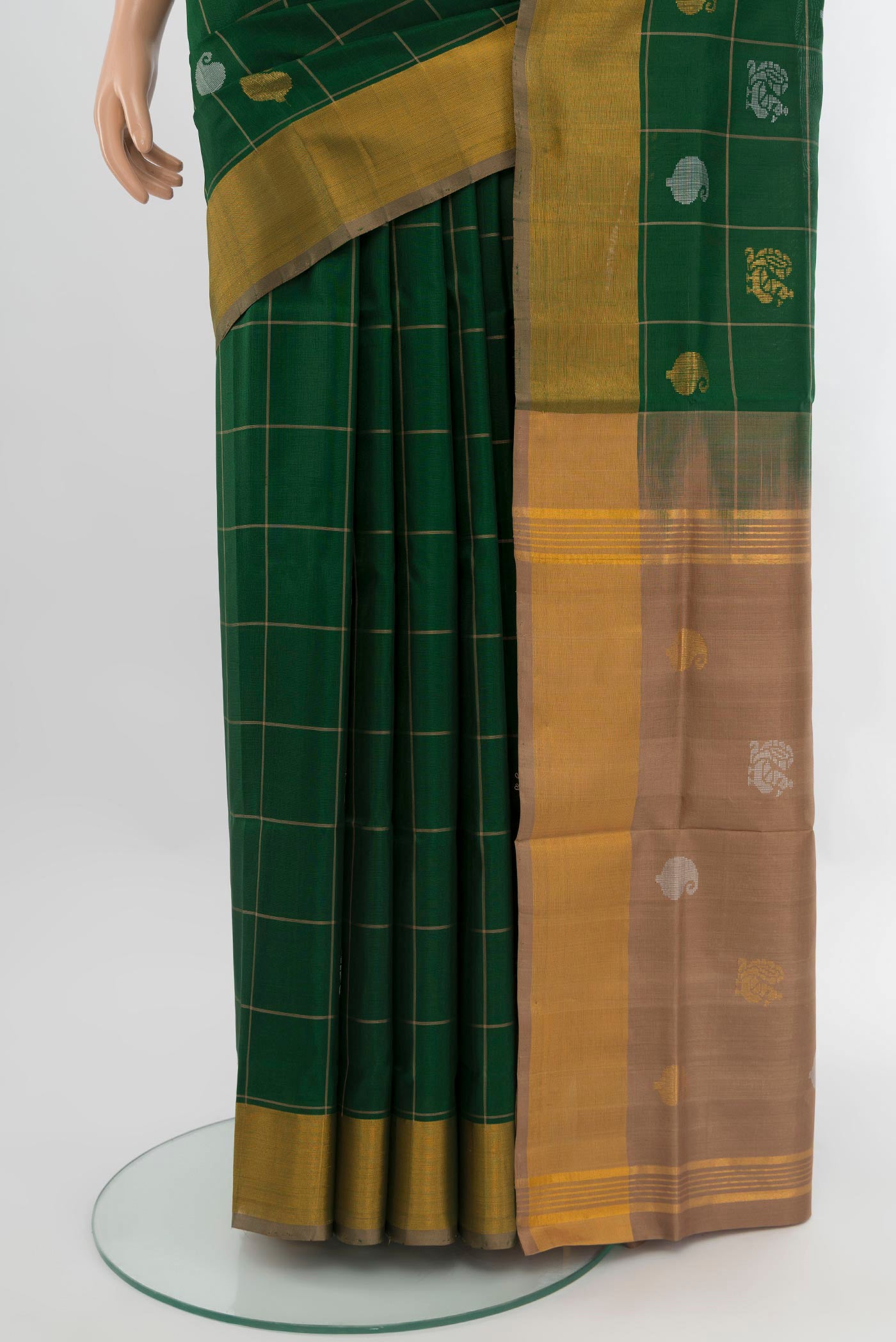 Pleats and pallu of Bottle Green Uppada Silk Saree with Checked design on the body and Zari Border. 
