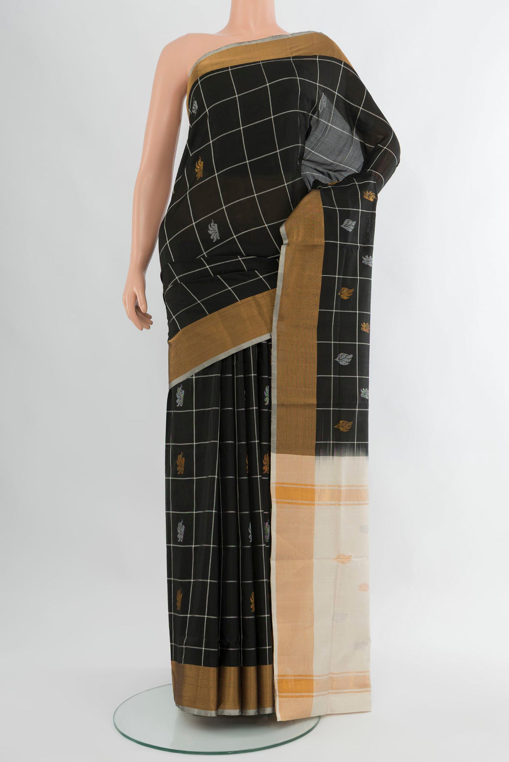 Black Uppada Silk Saree with Checked design on the body and Zari Border.  displayed on a mannequin