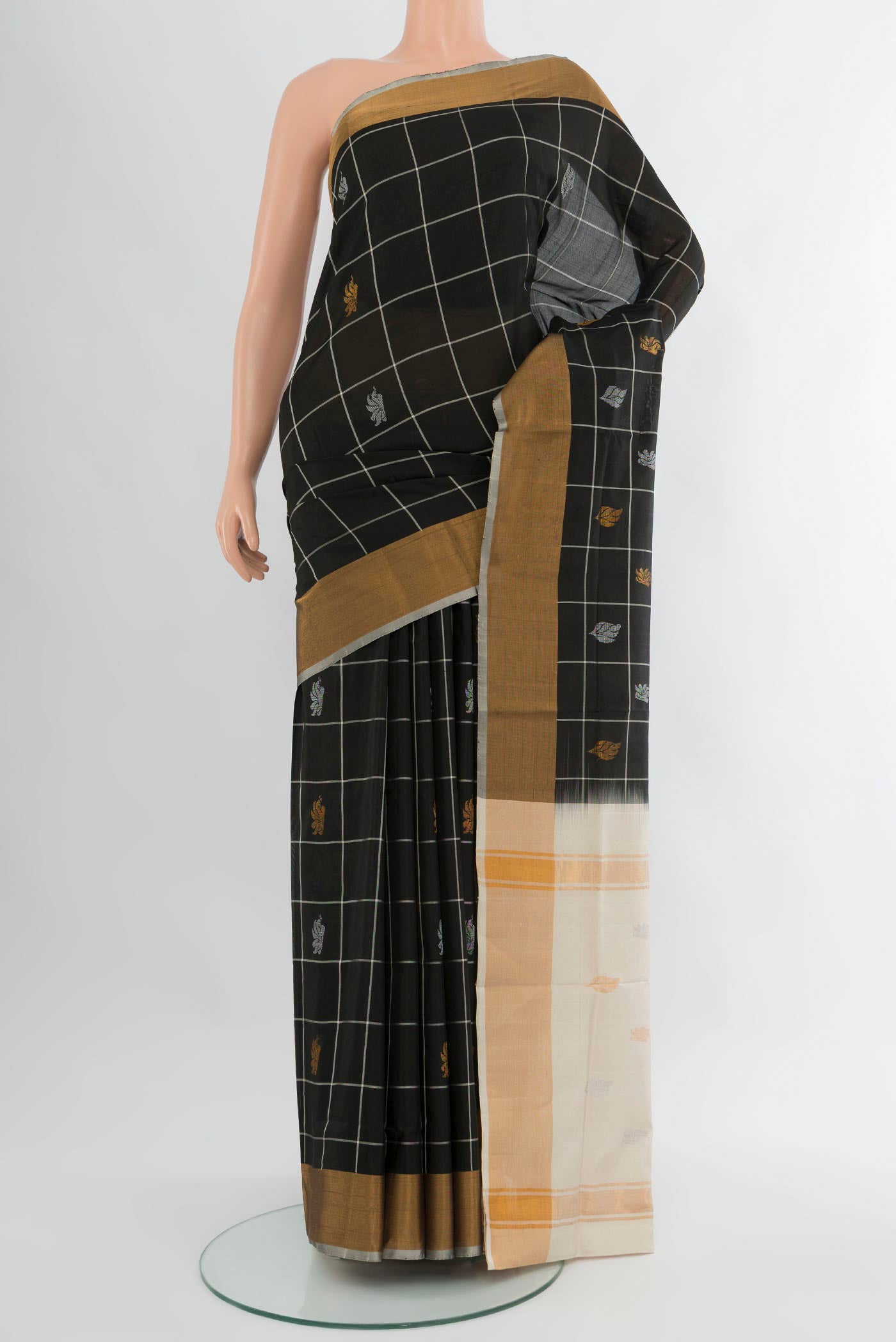 Black Uppada Silk Saree with Checked design on the body and Zari Border.  displayed on a mannequin