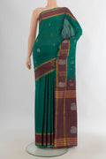Pure Silk Green Uppada Saree with Zari Butta on the body and Zari Border.  displayed on a mannequin