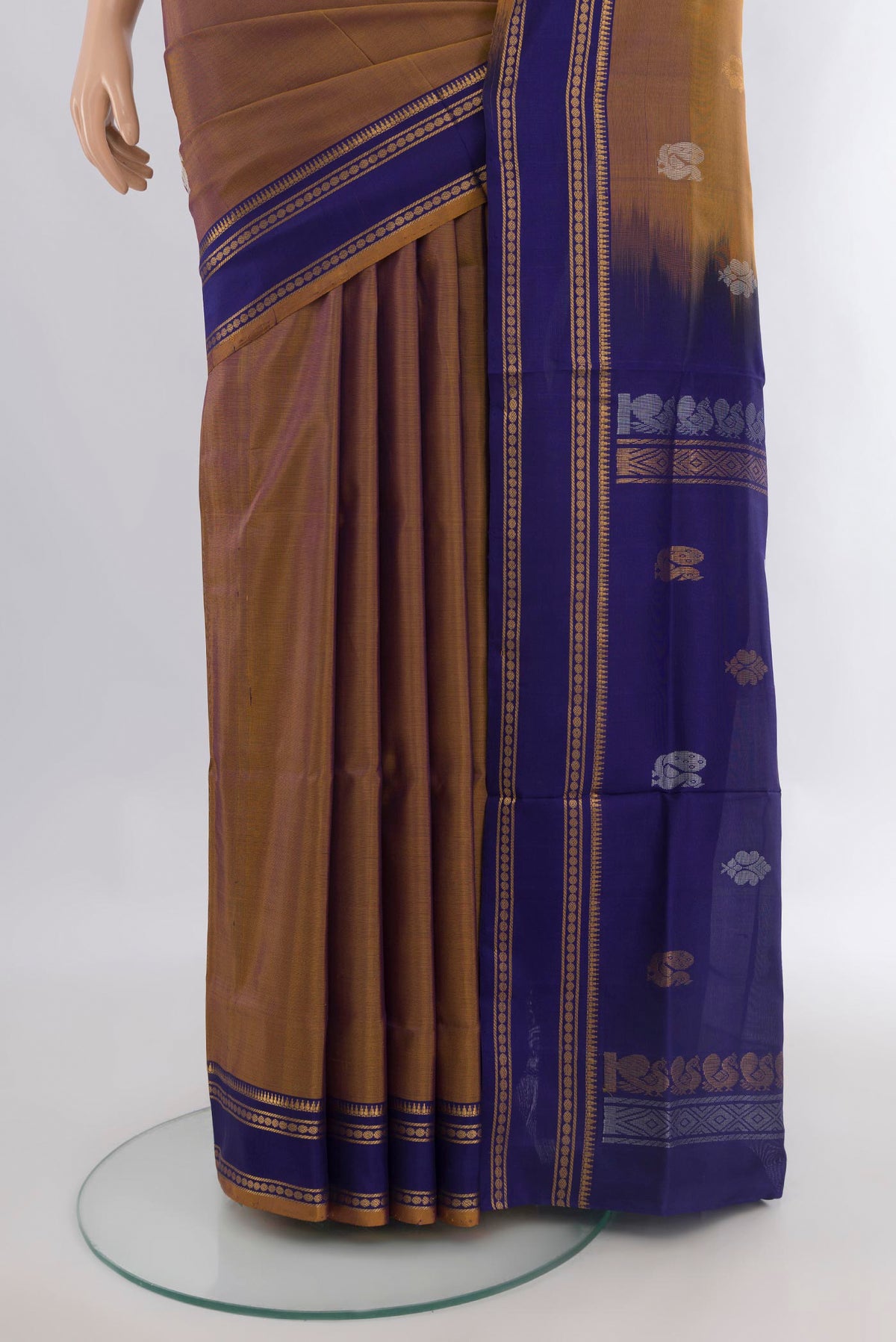 Pleats and pallu of Pure Silk Brown Uppada Saree with Zari Butta on the body and Plain Border. 