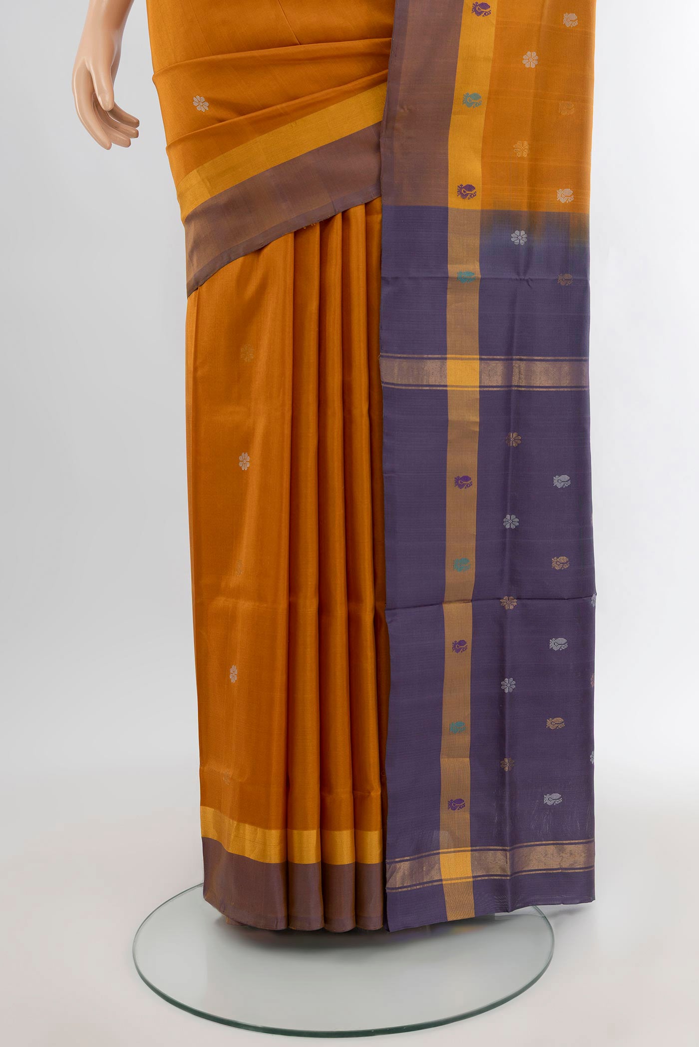 Pleats and pallu of Mustard Uppada Silk Saree with Zari Butta on the body and Plain Border. 