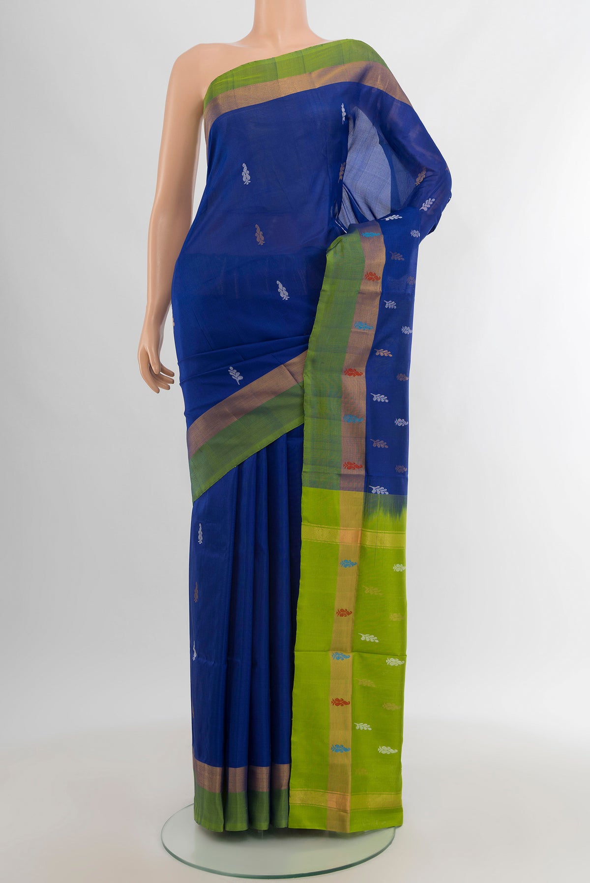 Blue Uppada Silk Saree with Zari Butta on the body and Zari Border.  displayed on a mannequin