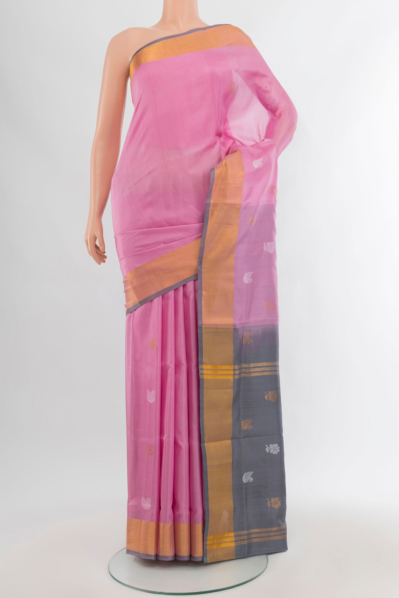 Rose pink Uppada Silk Saree with Zari Butta on the body and Zari Border.  displayed on a mannequin