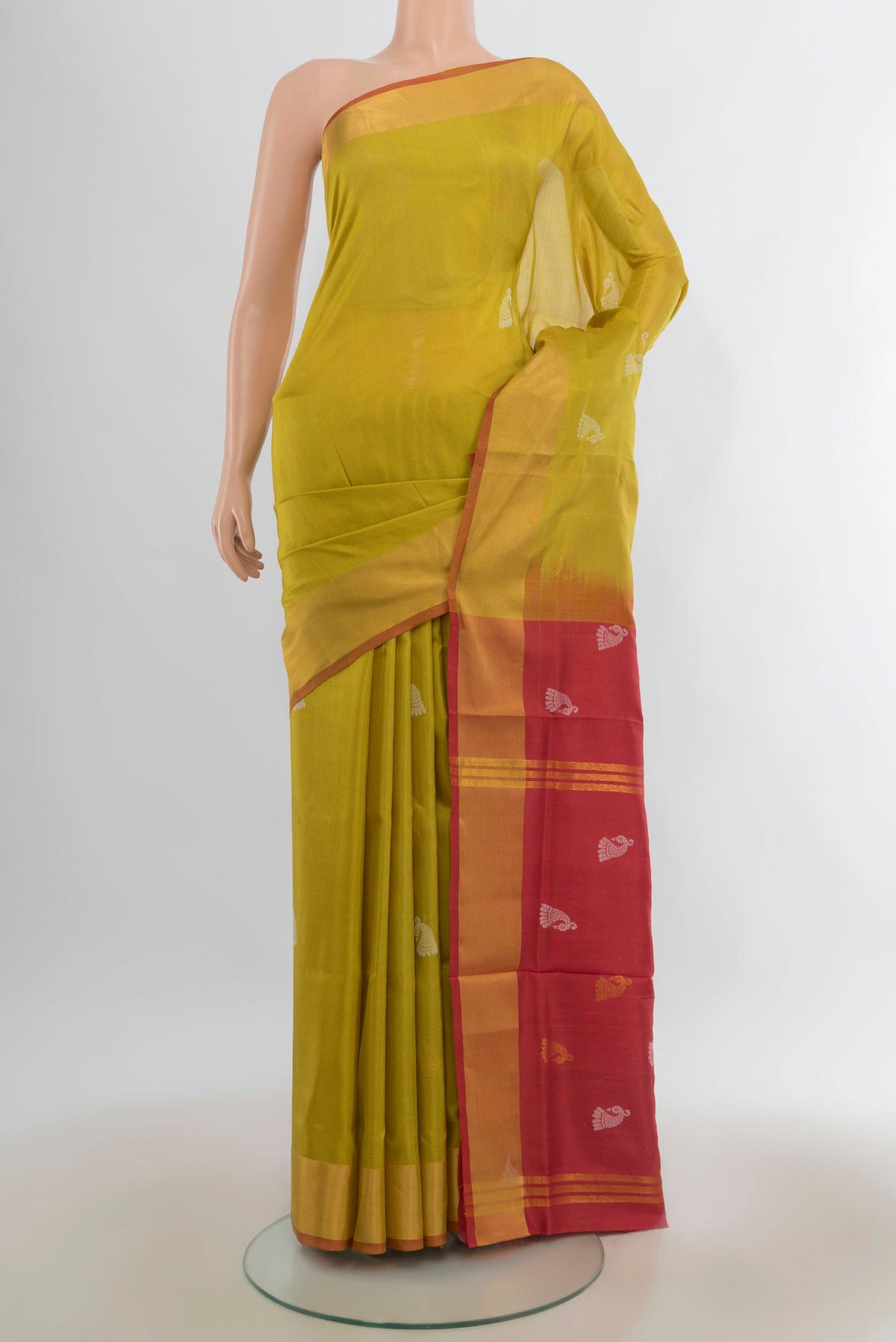 Pure Silk Mehandi Green Uppada Saree with Zari Butta on the body and Zari Border.  displayed on a mannequin