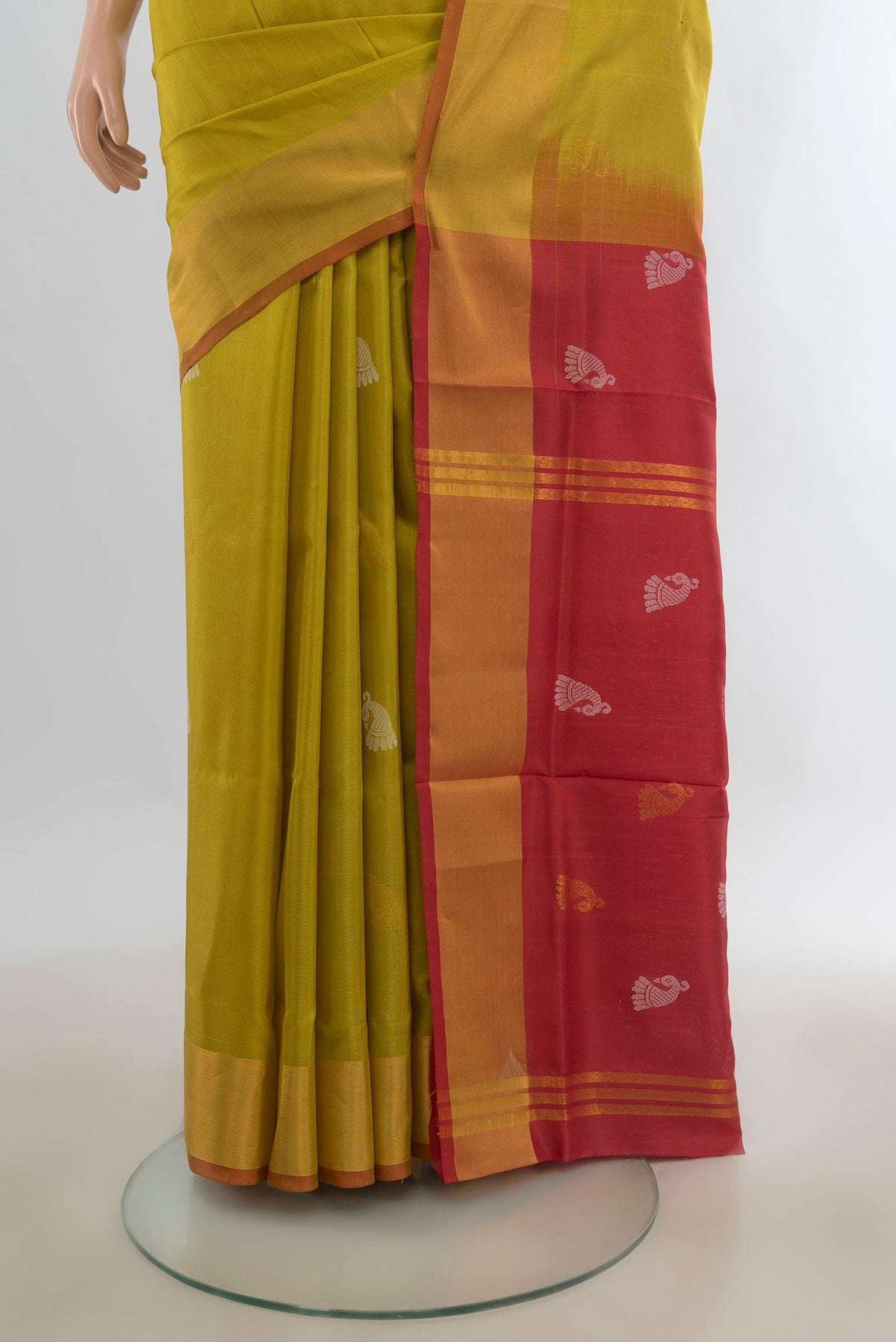 Pleats and pallu of Pure Silk Mehandi Green Uppada Saree with Zari Butta on the body and Zari Border. 