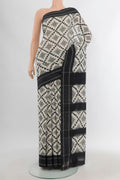 Off White Pochampally Cotton Saree with Ikat design on the body and Plain Border.  displayed on a mannequin