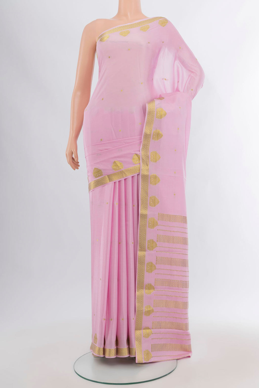 Rose pink Mysore Crepe Saree with Zari Butta on the body and Zari Border.  displayed on a mannequin