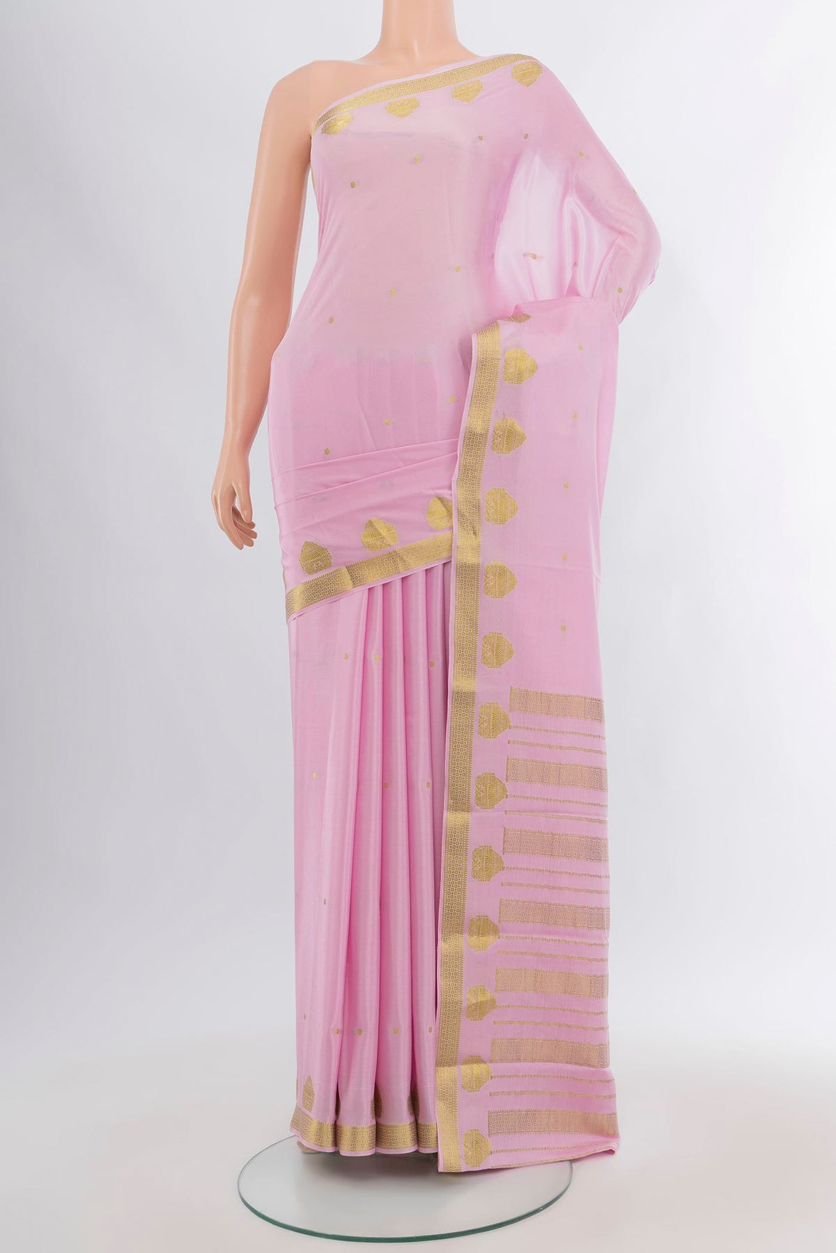 Rose pink Mysore Crepe Saree with Zari Butta on the body and Zari Border.  displayed on a mannequin