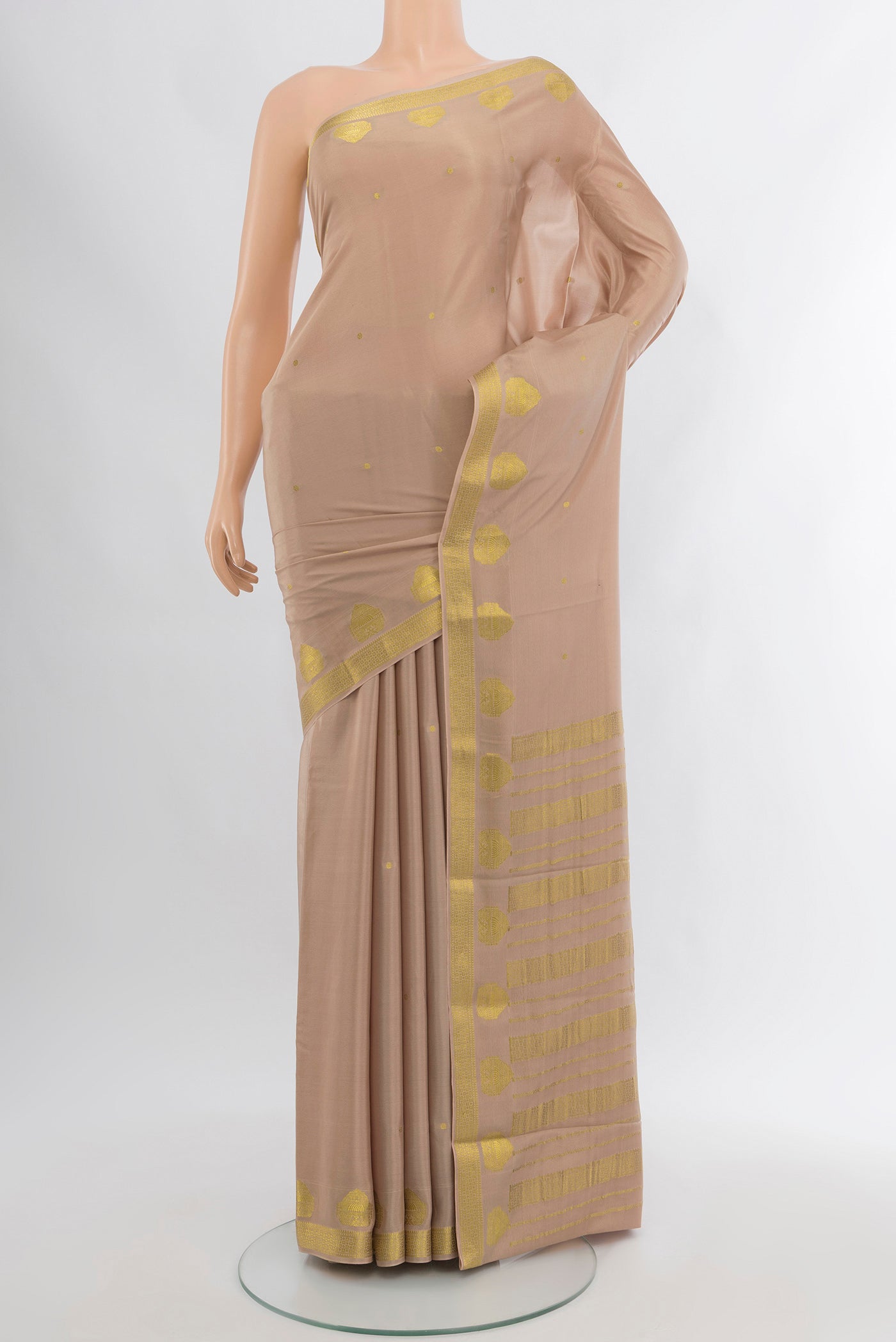 Rose Gold Mysore Crepe Saree with Zari Butta on the body and Zari Border.  displayed on a mannequin