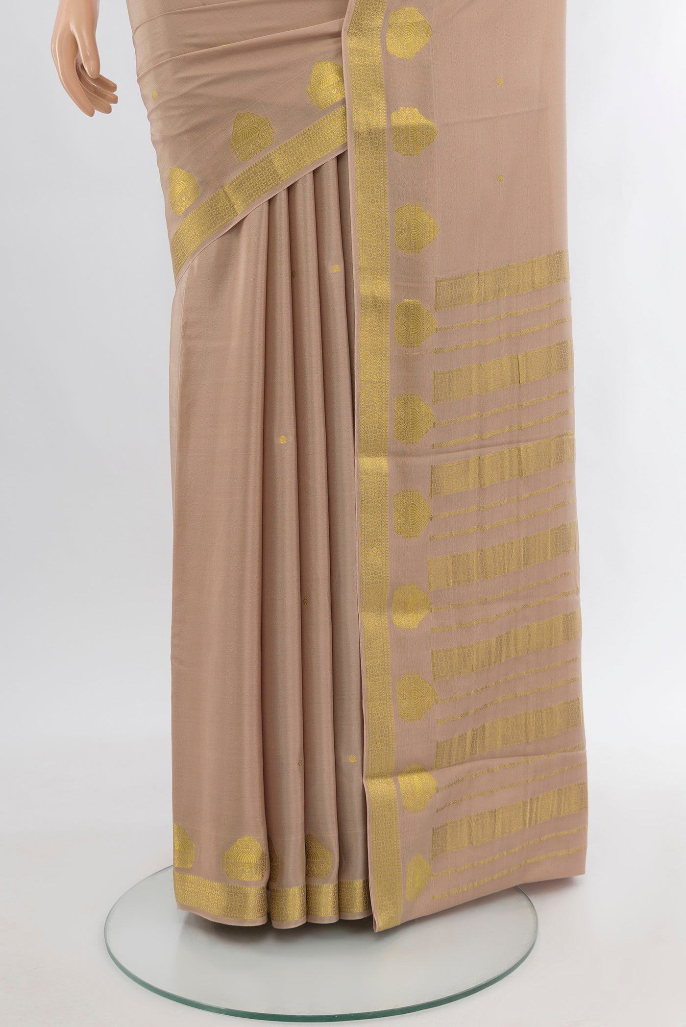Pleats and pallu of Rose Gold Mysore Crepe Saree with Zari Butta on the body and Zari Border. 