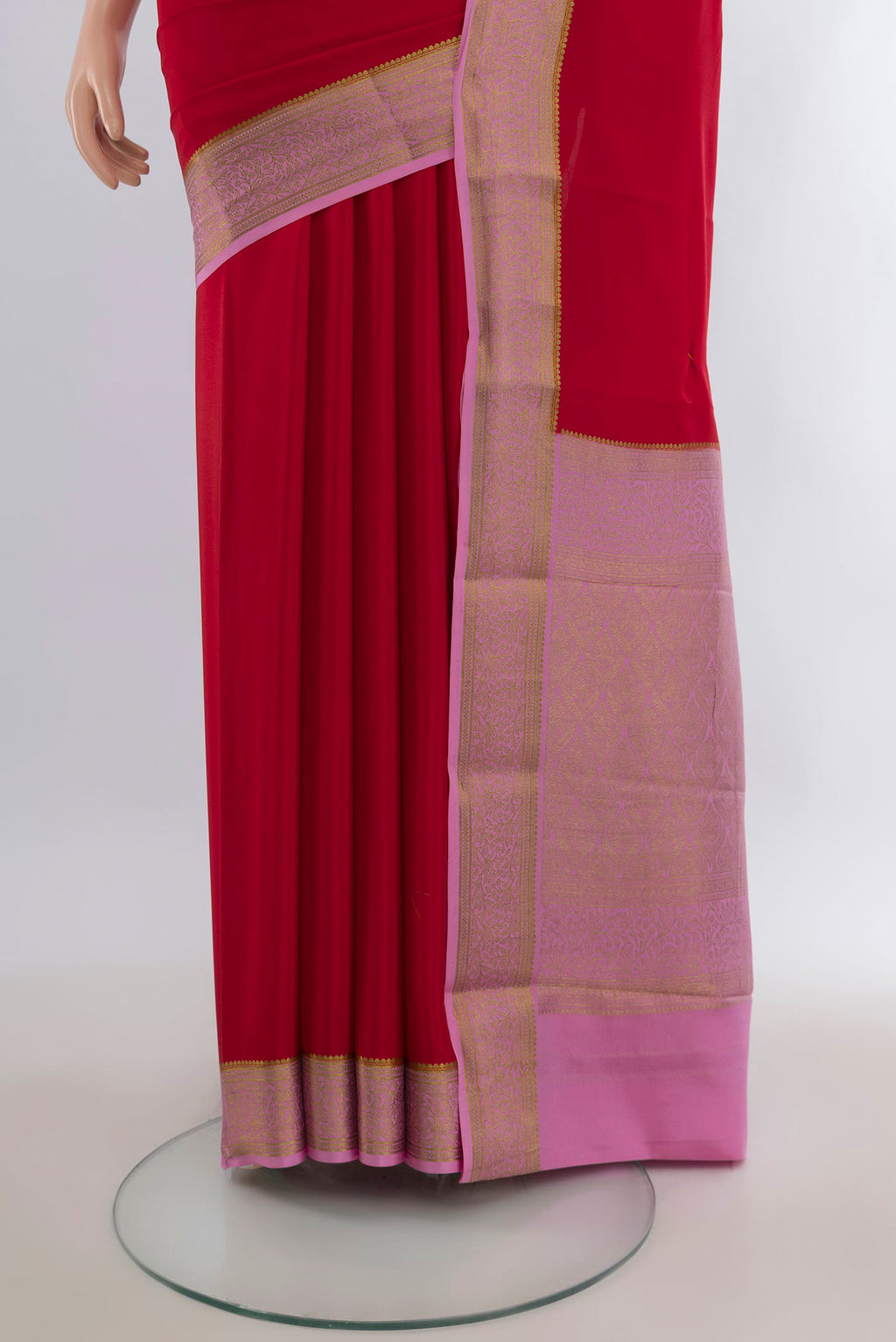 Pleats and pallu of Red Mysore Crepe Saree with Plain Body and Zari Border. 