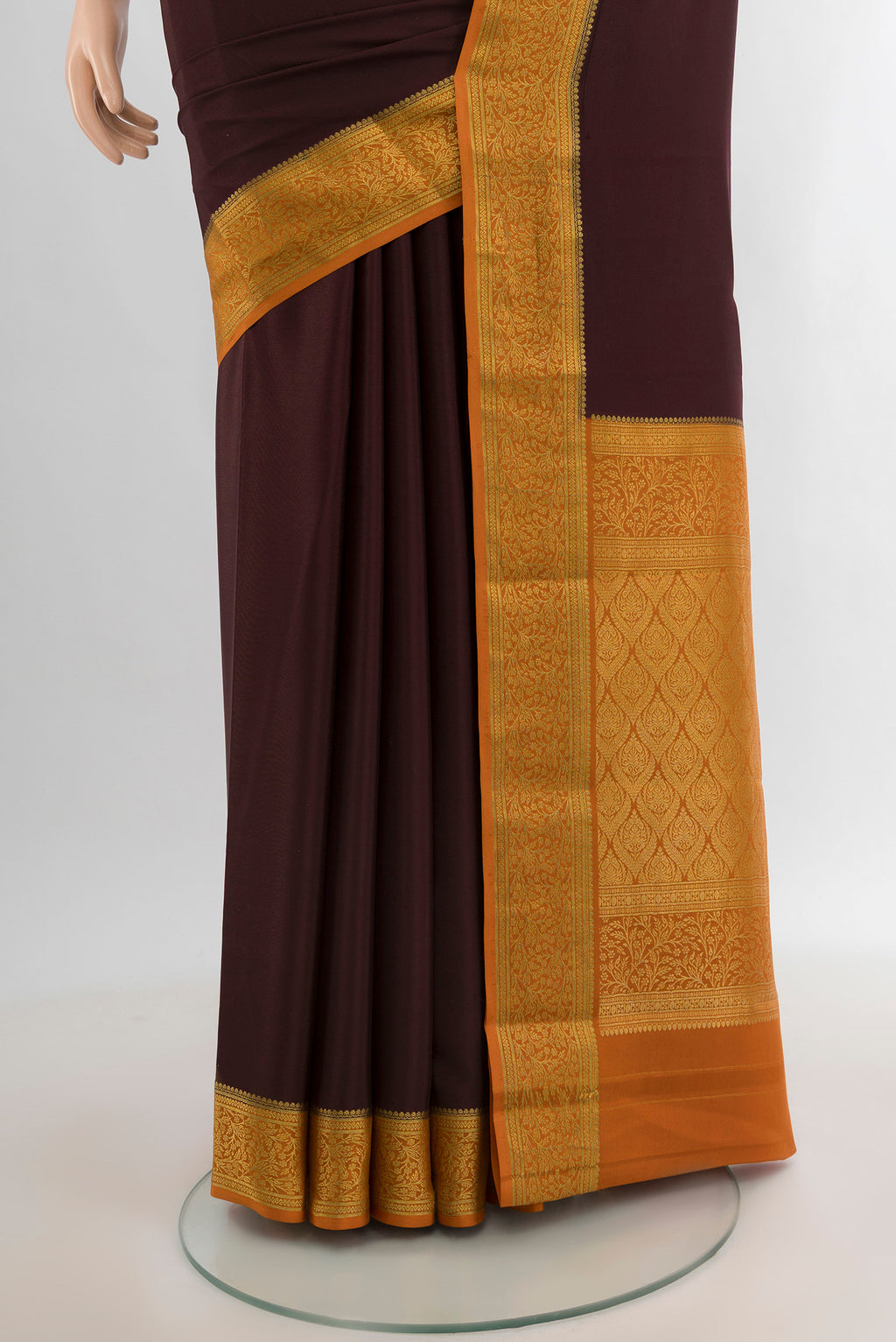 Pleats and pallu of Coffee Brown Mysore Crepe Saree with Plain Body and Zari Border. 
