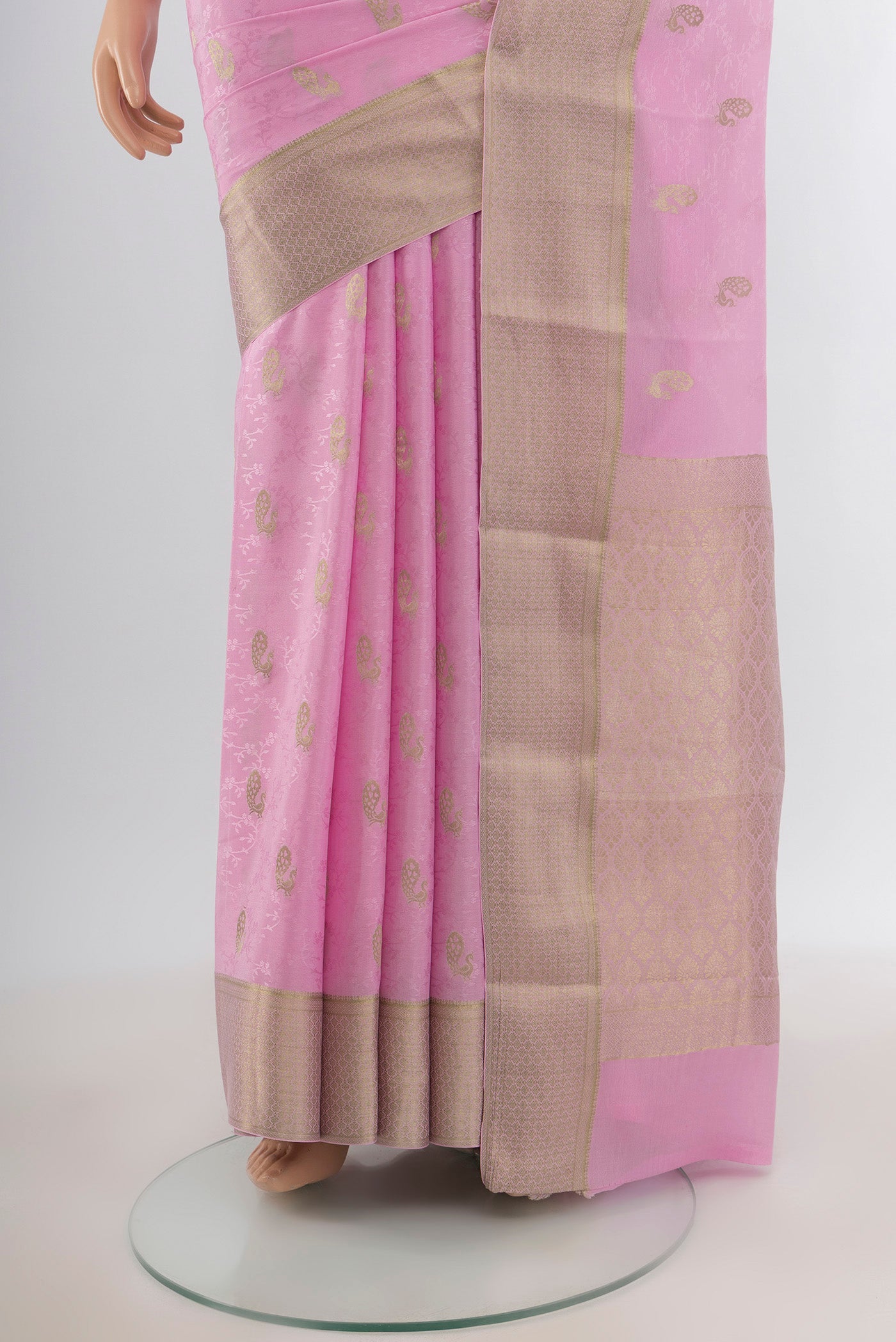 Pleats and pallu of Rose pink Mysore Crepe Saree with Jacquard With Zari Butta on the body and Zari Border. 