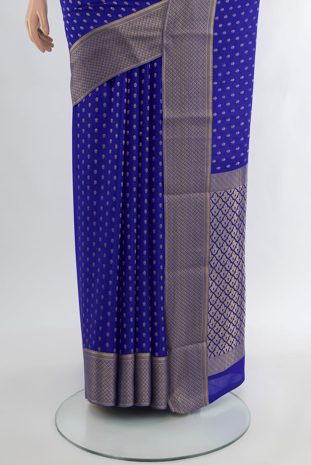 Pleats and pallu of Dark Blue Mysore Crepe Saree with Zari Butta on the body and Silk Border. 