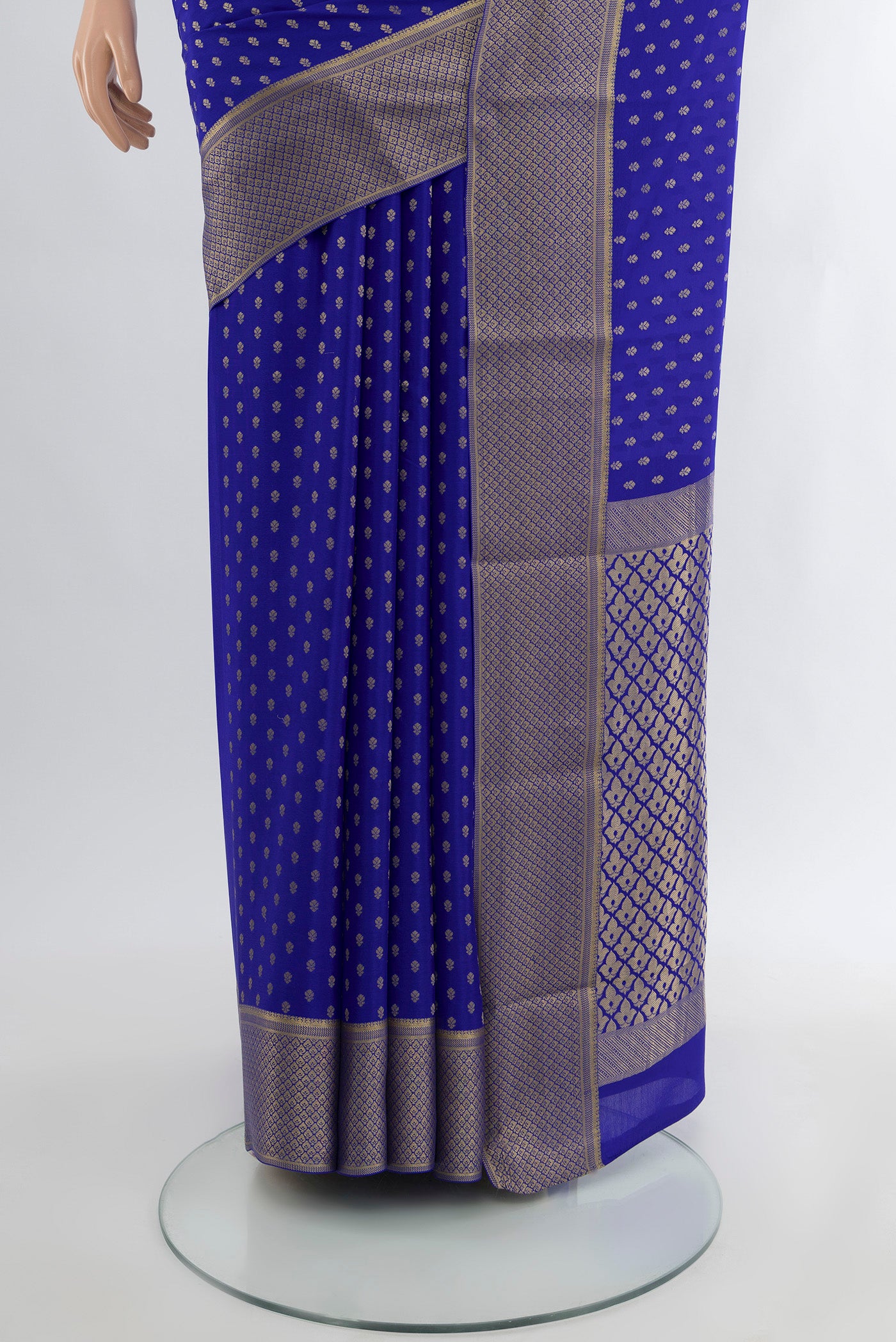 Pleats and pallu of Dark Blue Mysore Crepe Saree with Zari Butta on the body and Silk Border. 