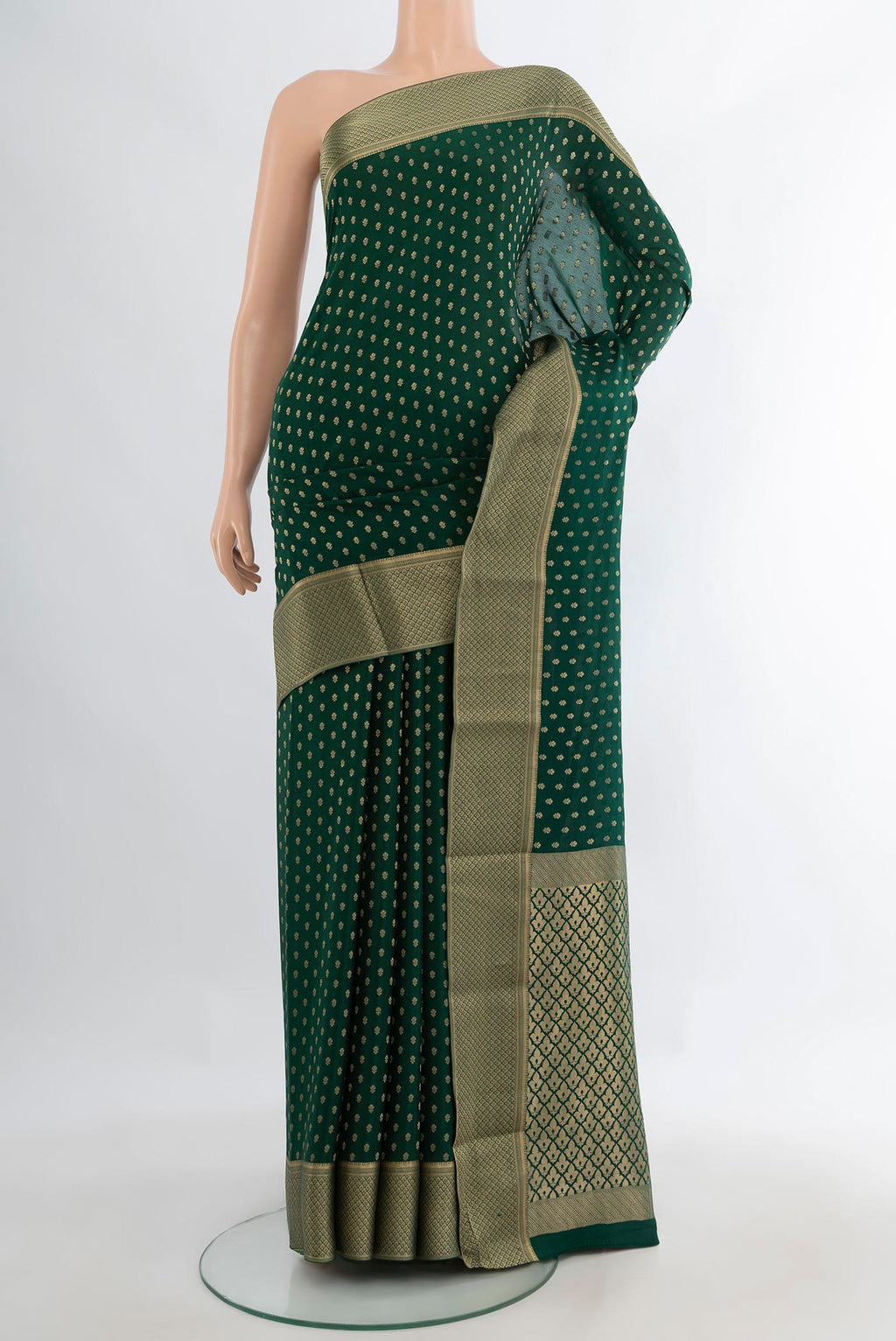 Green Mysore Crepe Saree with Zari Butta on the body and Zari Border.  displayed on a mannequin