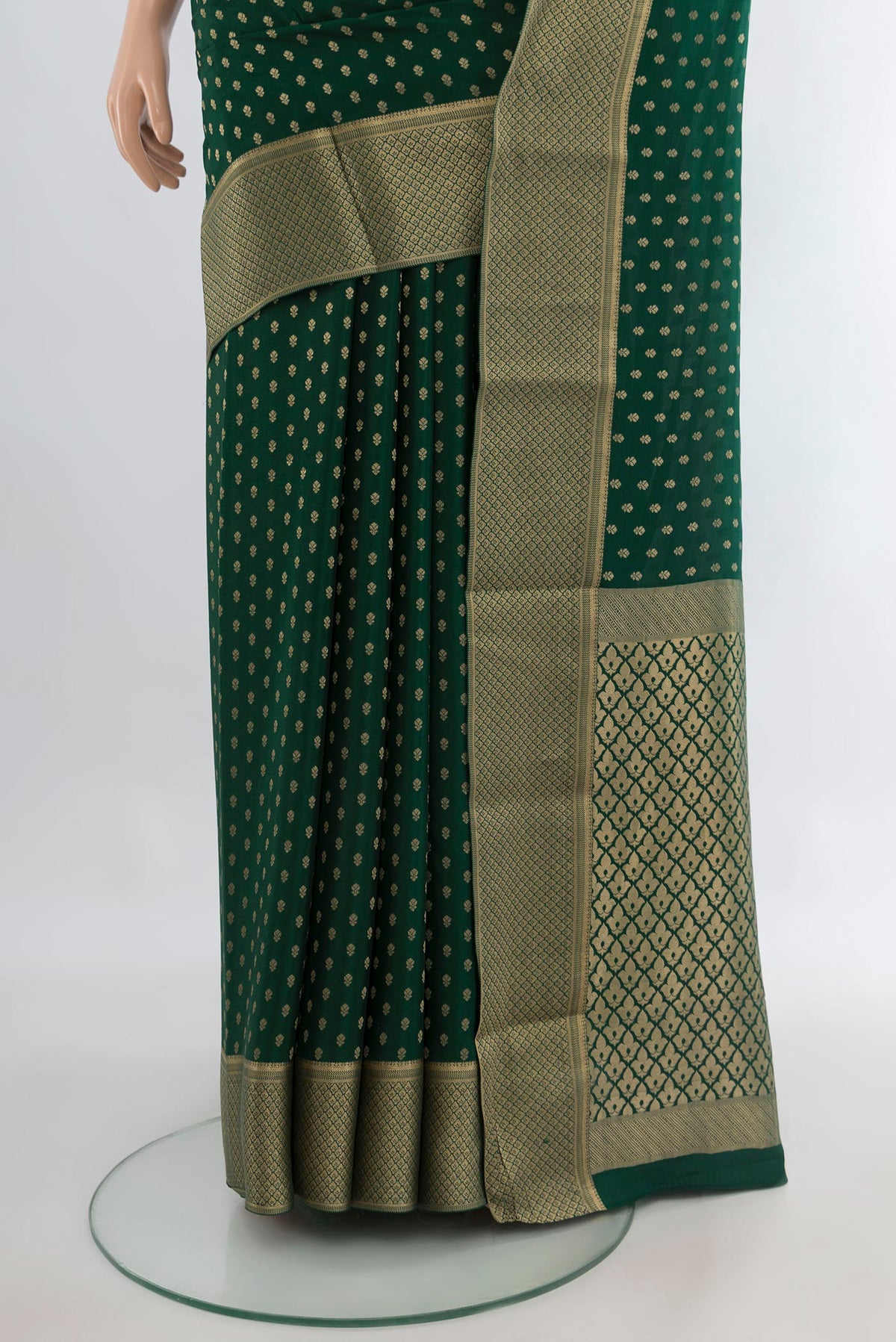 Pleats and pallu of Green Mysore Crepe Saree with Zari Butta on the body and Zari Border. 