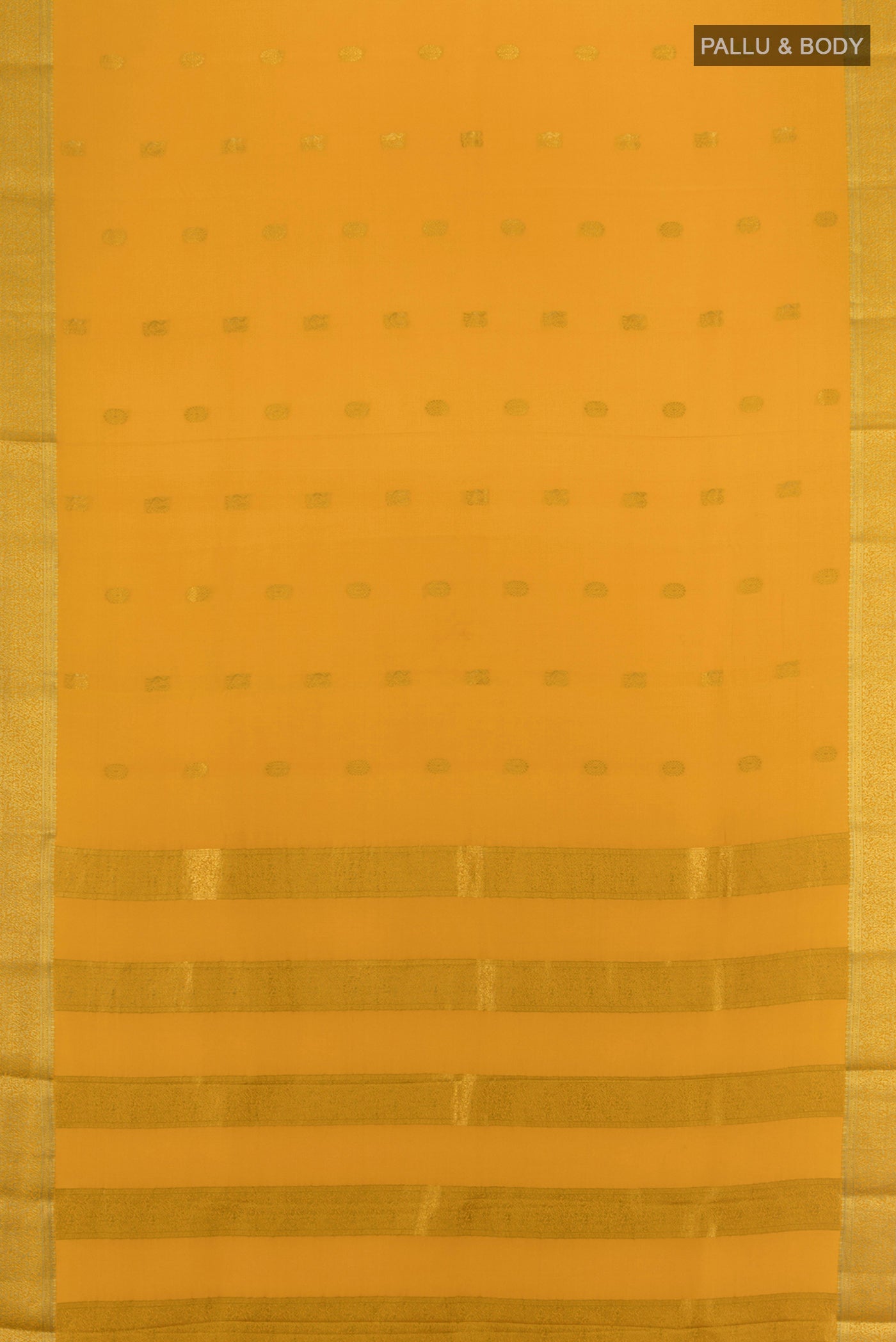 Flat view of Mustard Mysore Crepe Saree with Zari Butta on the body and Zari Border. 