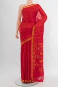 Red Uppada Silk Saree with Zari Butta on the body and Fancy Border.  displayed on a mannequin
