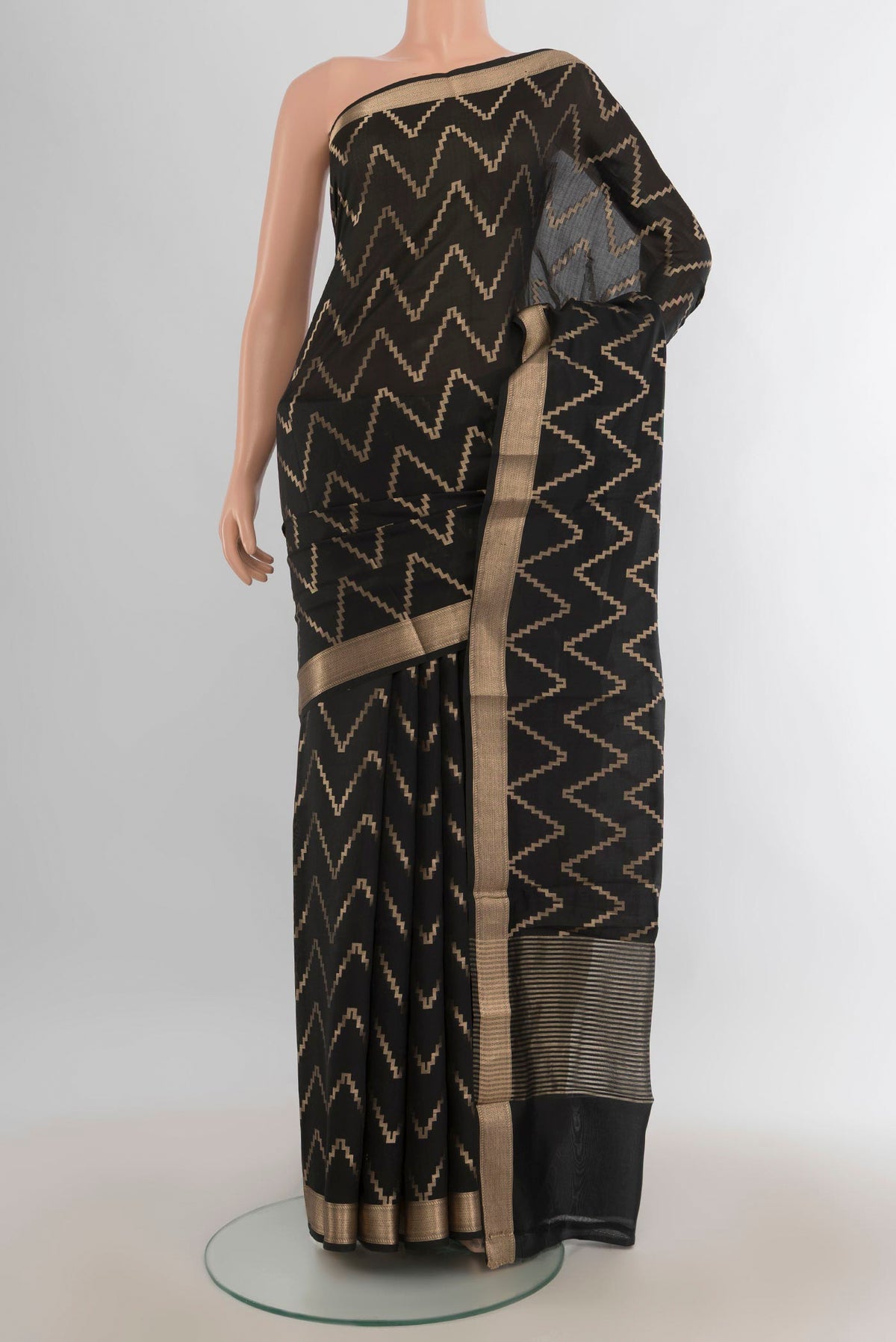 Pure Silk Black Banarasi Katan Saree with Zari Butta on the body and Silk Border.  displayed on a mannequin