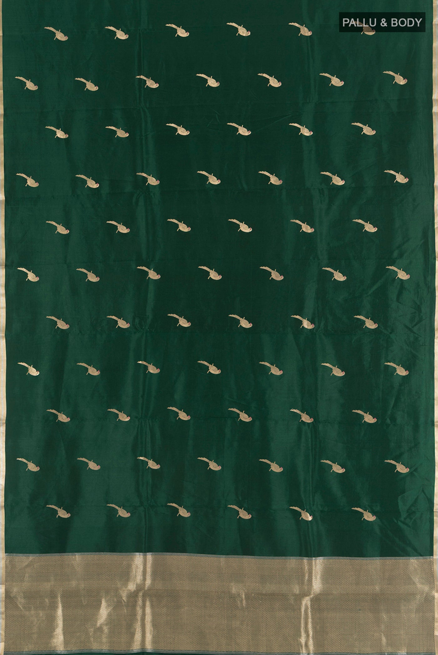 Flat view of Bottle Green Banarasi Katan Silk Saree with Zari Butta on the body and Zari Border. 