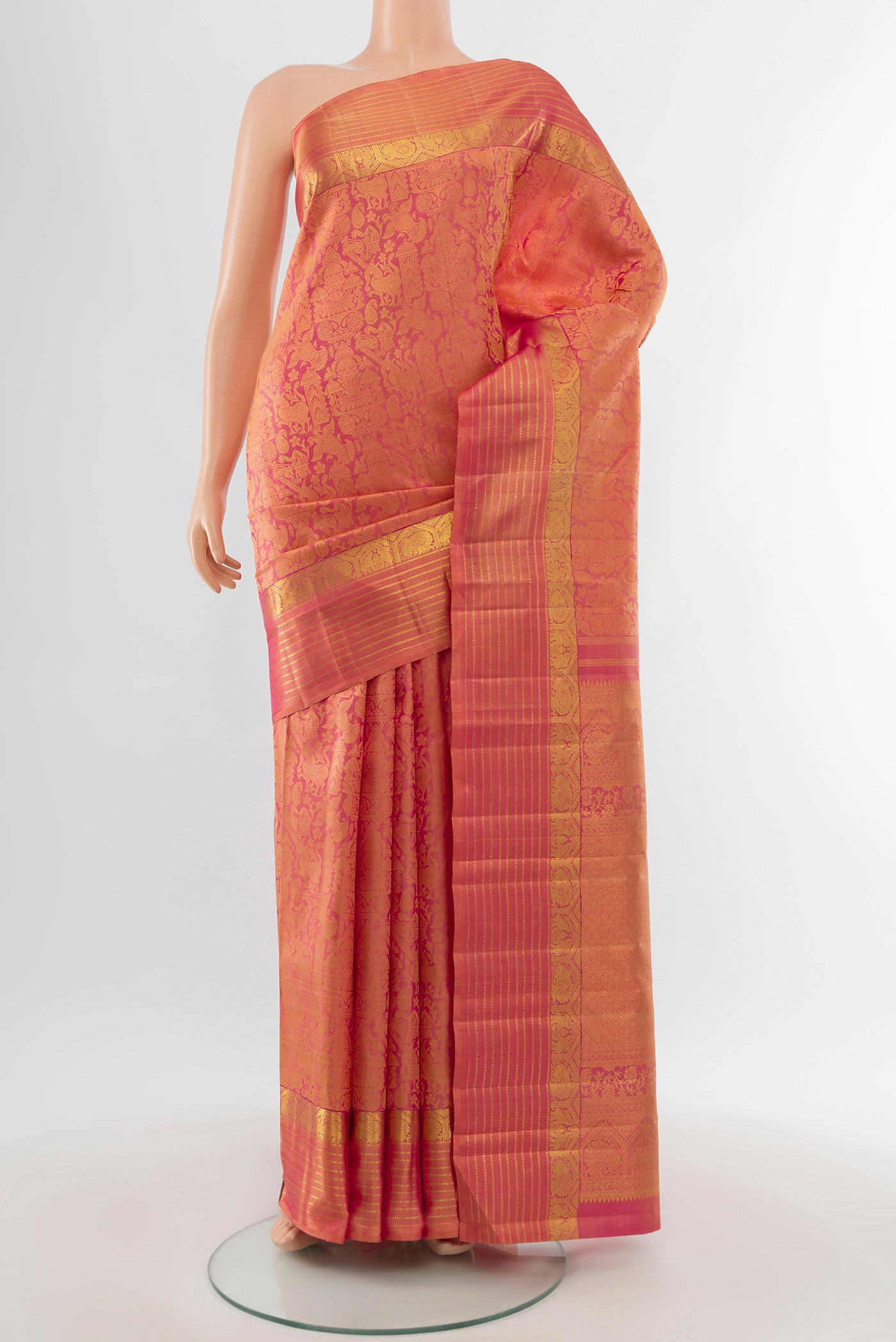 Golden Peach Dual Tone Kanchipuram Silk Saree with Zari Brocade on the body and Zari Border.  displayed on a mannequin