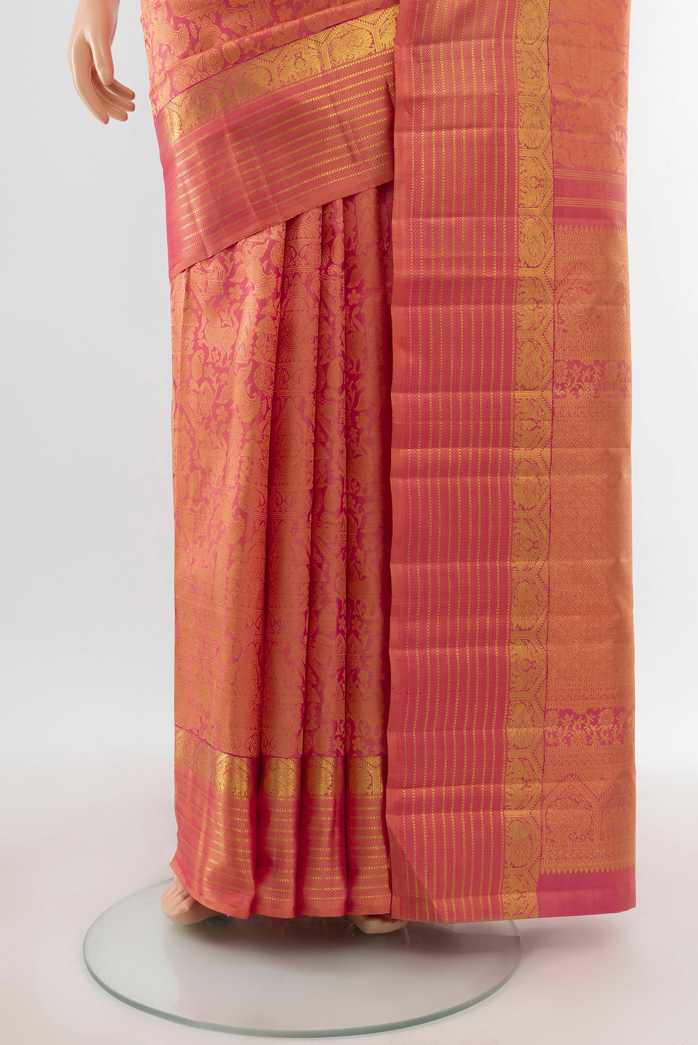 Pleats and pallu of Golden Peach Dual Tone Kanchipuram Silk Saree with Zari Brocade on the body and Zari Border. 